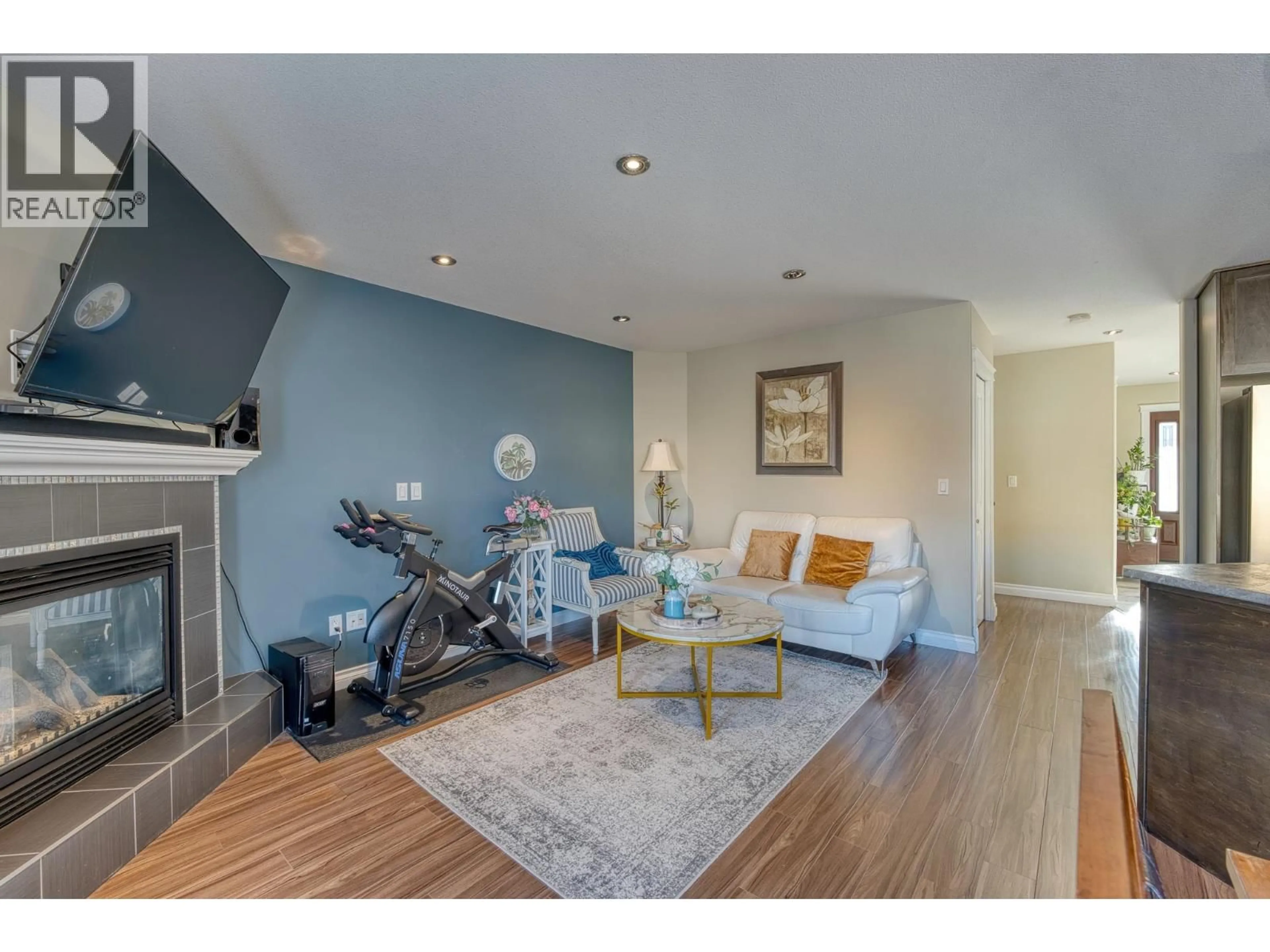 Living room with furniture, wood/laminate floor for 10922 104A AVENUE, Fort St. John British Columbia V1J0J3