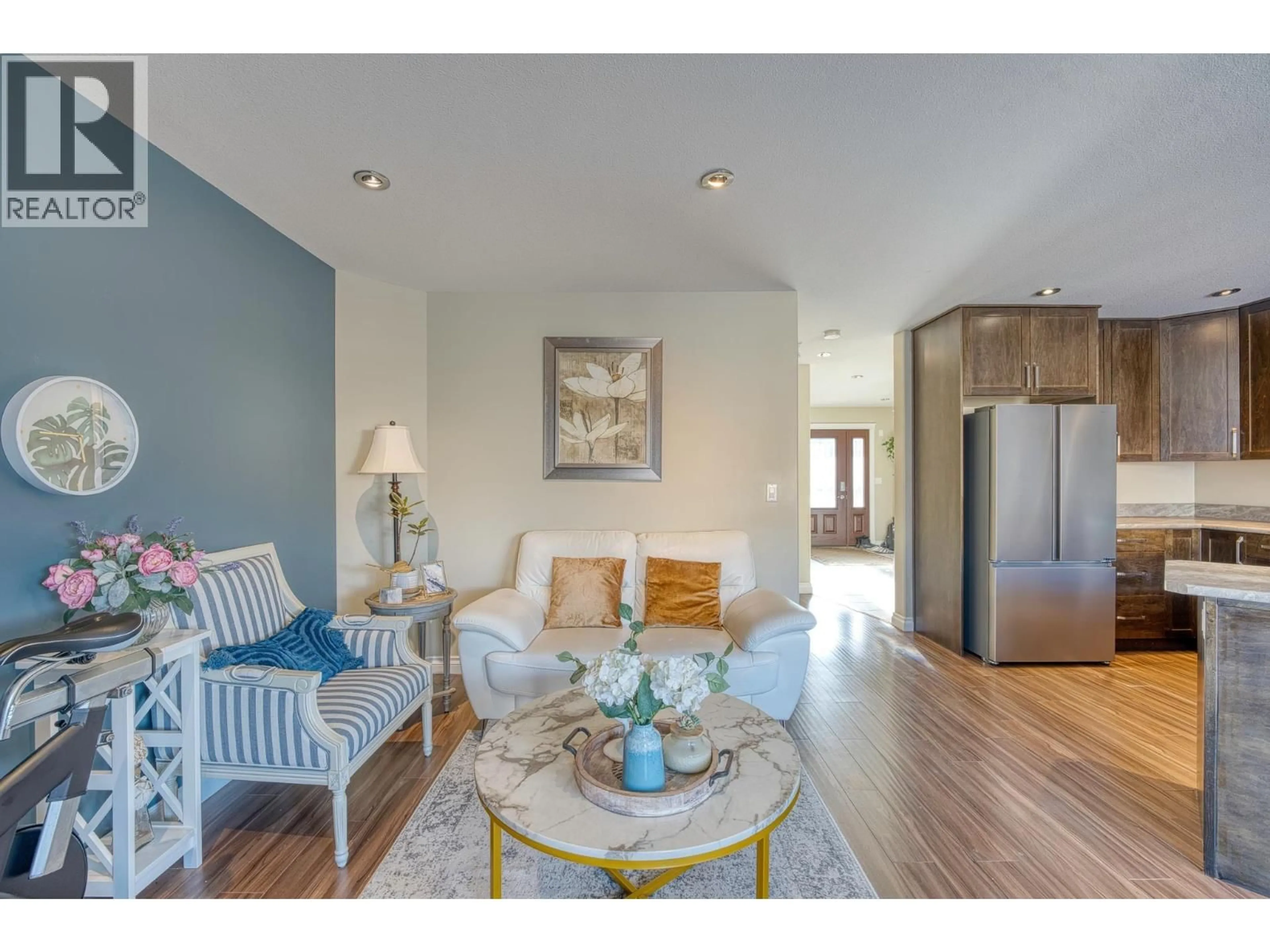 Living room with furniture, wood/laminate floor for 10922 104A AVENUE, Fort St. John British Columbia V1J0J3