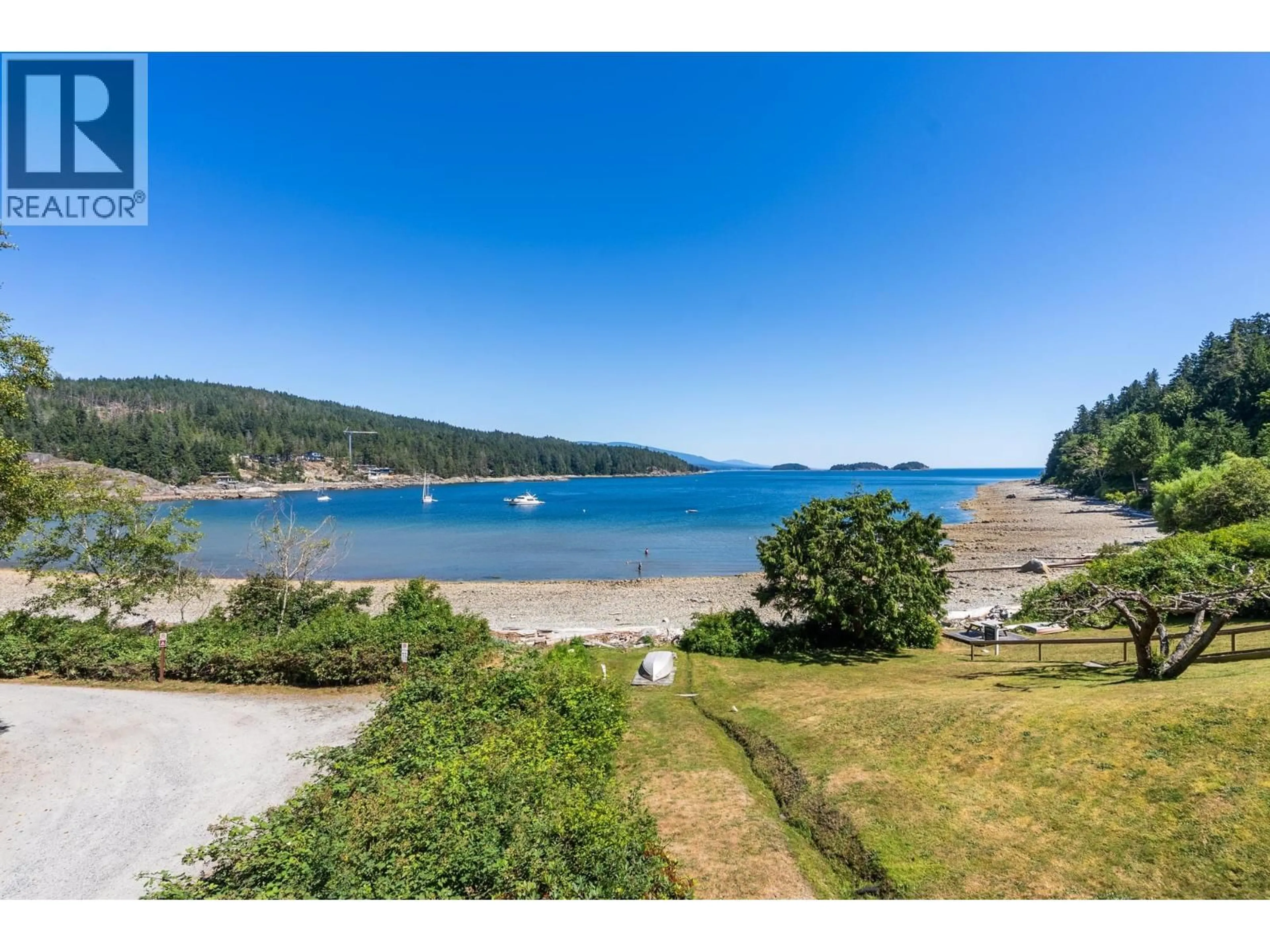 A pic from outside/outdoor area/front of a property/back of a property/a pic from drone, water/lake/river/ocean view for 7653 REDROOFFS ROAD, Halfmoon Bay British Columbia V7Z1C4
