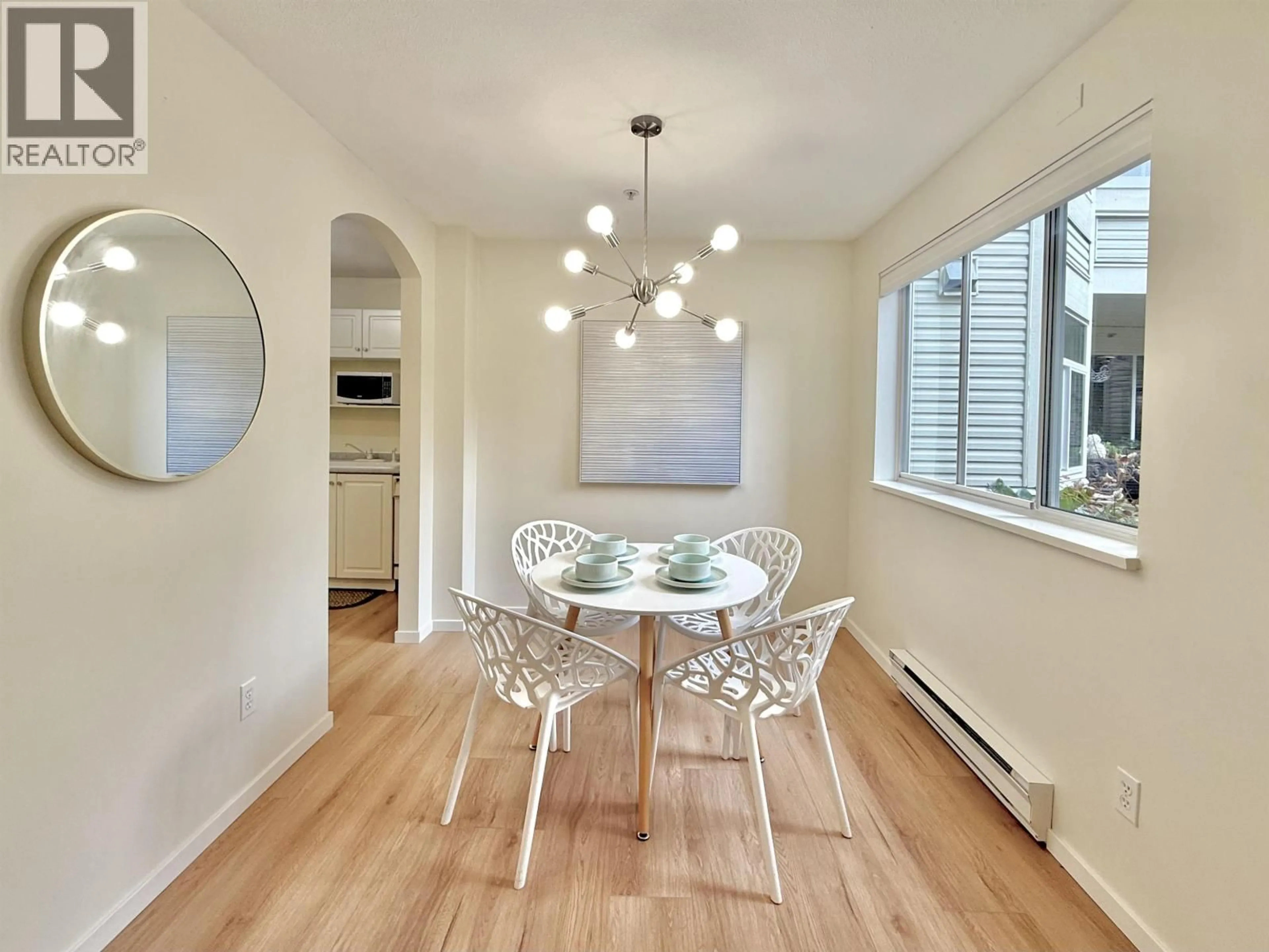 Dining room, wood/laminate floor for 101 - 3638 RAE AVENUE, Vancouver British Columbia V5R2P5
