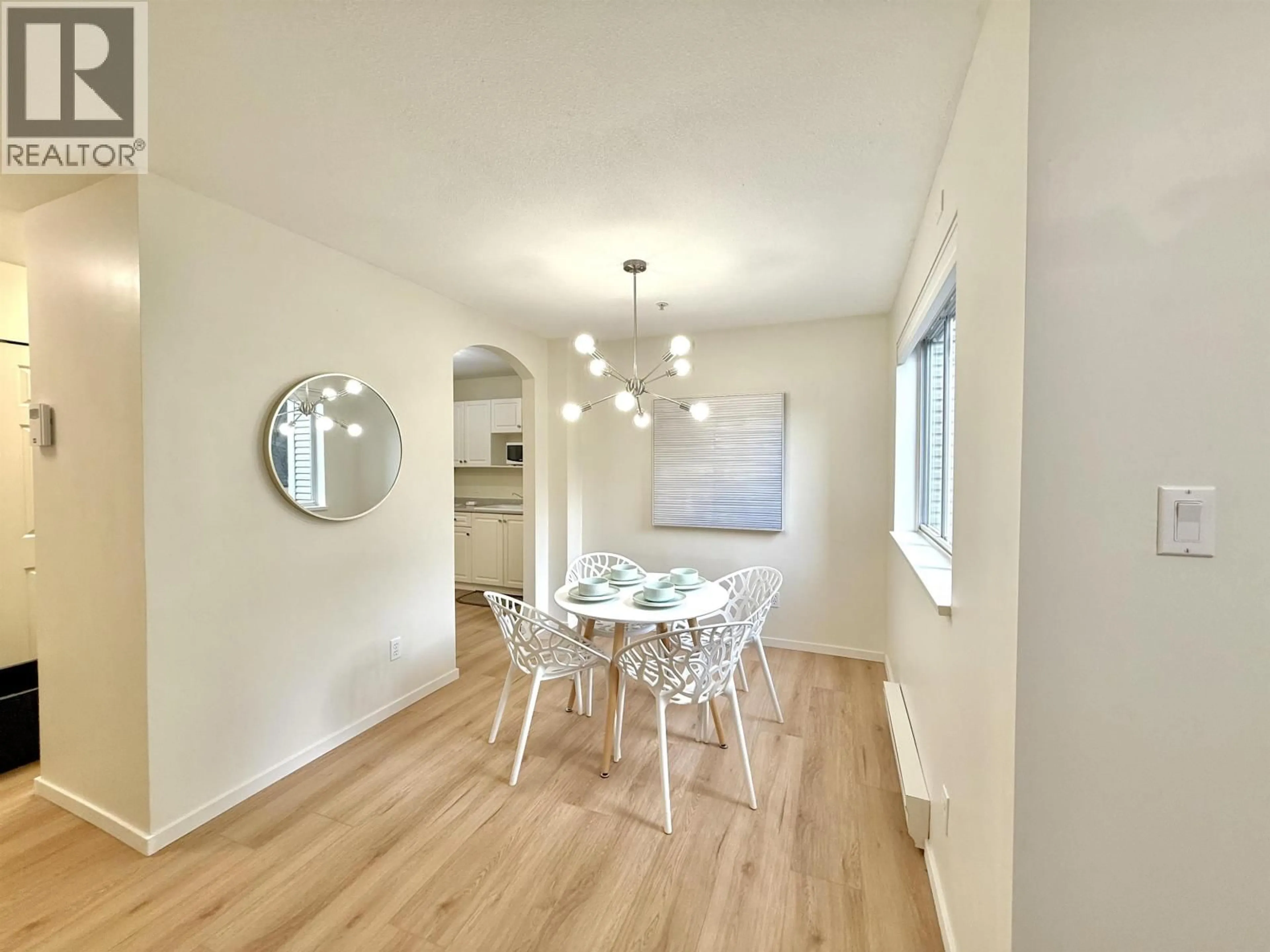 Dining room, wood/laminate floor for 101 - 3638 RAE AVENUE, Vancouver British Columbia V5R2P5