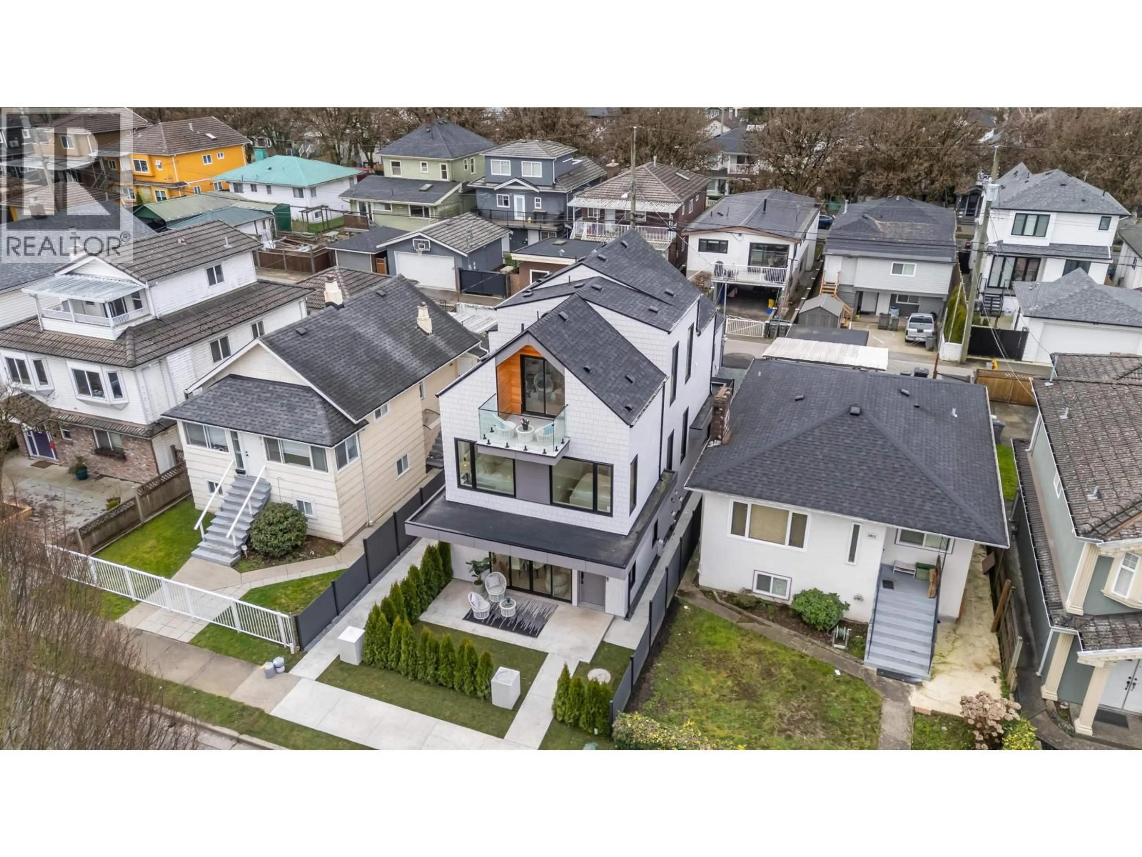 A pic from outside/outdoor area/front of a property/back of a property/a pic from drone, street for 1 - 5023 ROSS STREET, Vancouver British Columbia V5W3K6