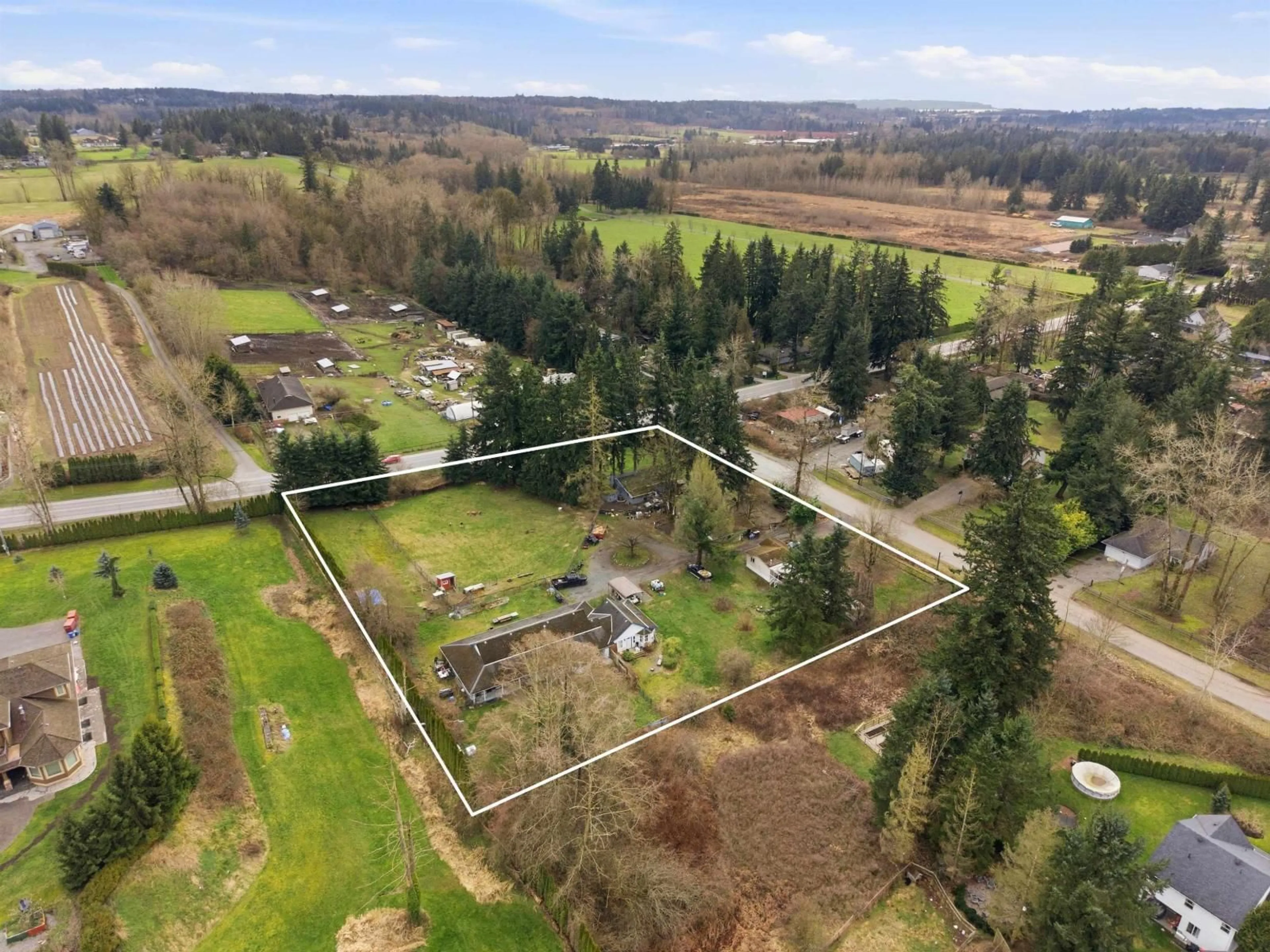 A pic from outside/outdoor area/front of a property/back of a property/a pic from drone, unknown for 19751 16 AVENUE, Langley British Columbia V2Z1K2