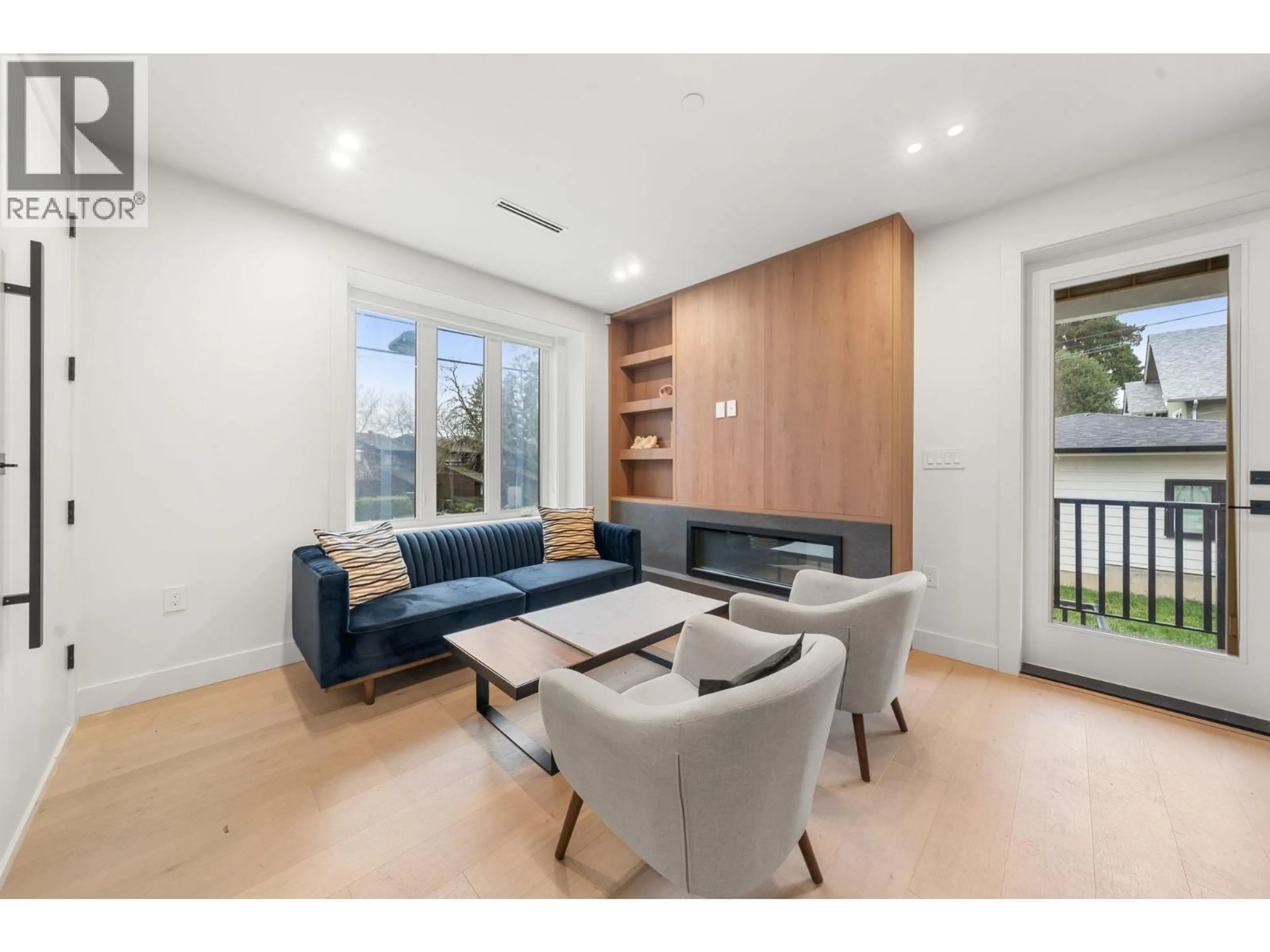 Living room with furniture, wood/laminate floor for 3483 ADANAC STREET, Vancouver British Columbia V5K4P4