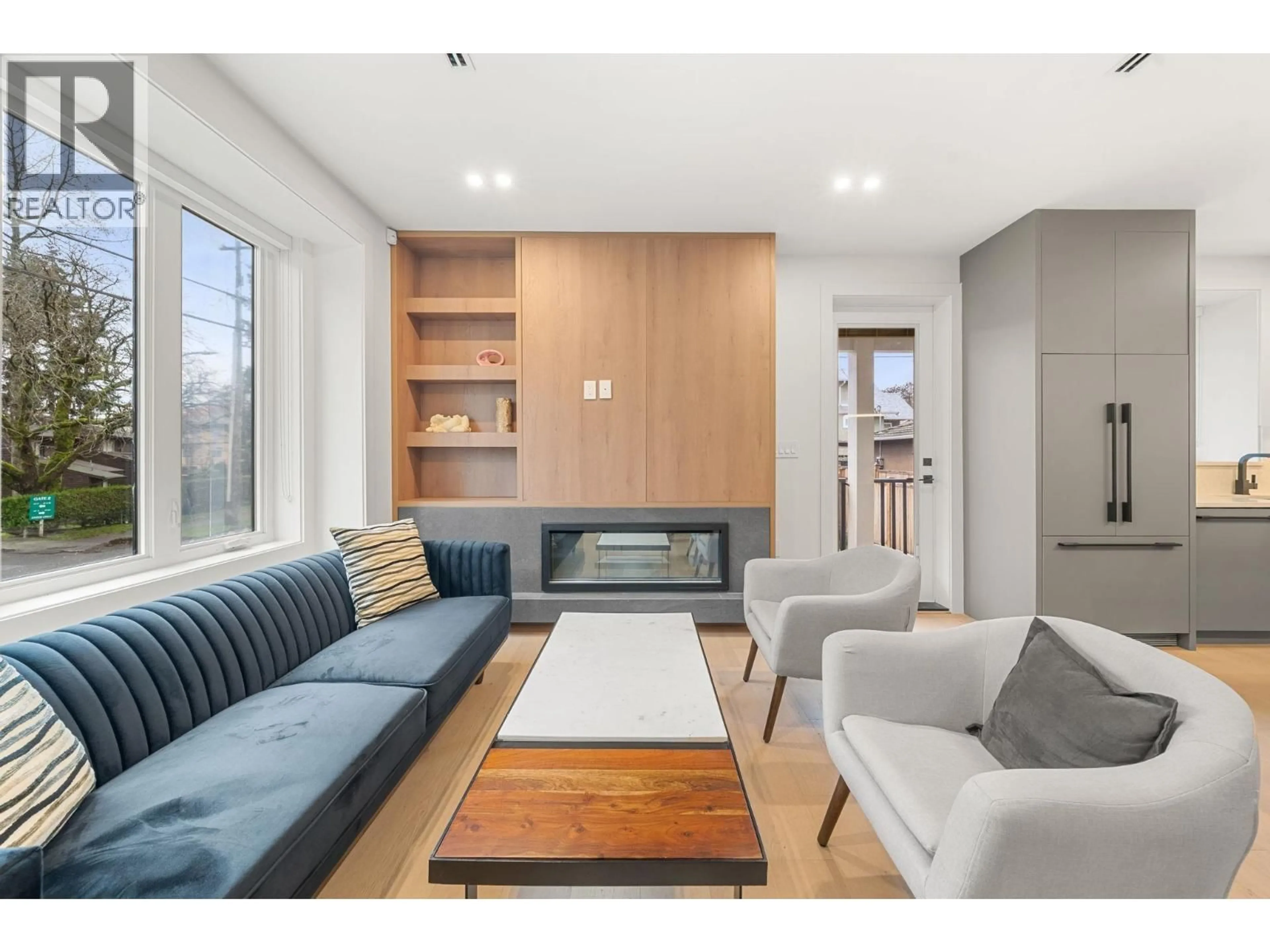 Living room with furniture, wood/laminate floor for 3483 ADANAC STREET, Vancouver British Columbia V5K4P4