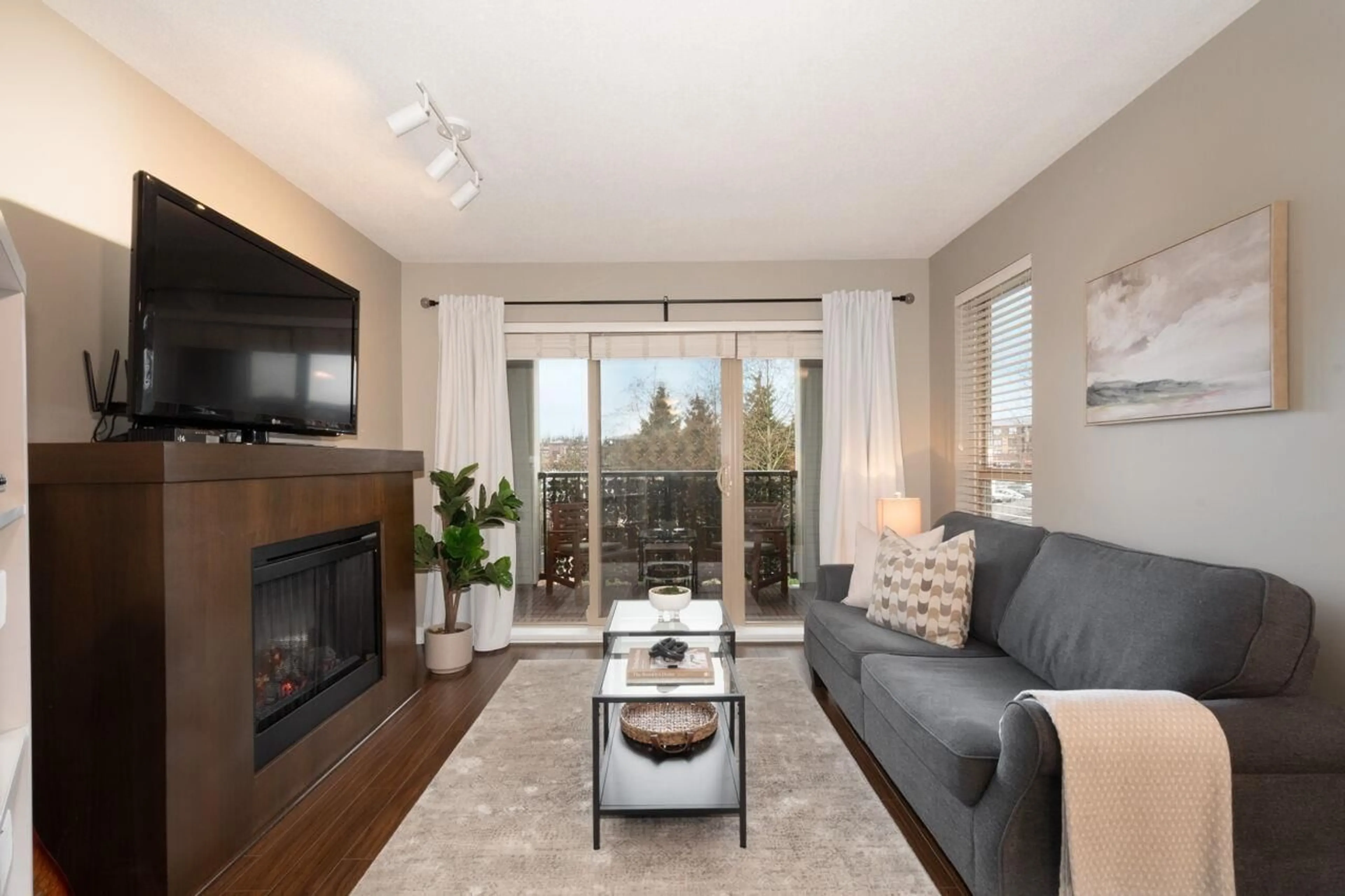 Living room with furniture, wood/laminate floor for D207 - 8929 202 STREET, Langley British Columbia V1M0B4