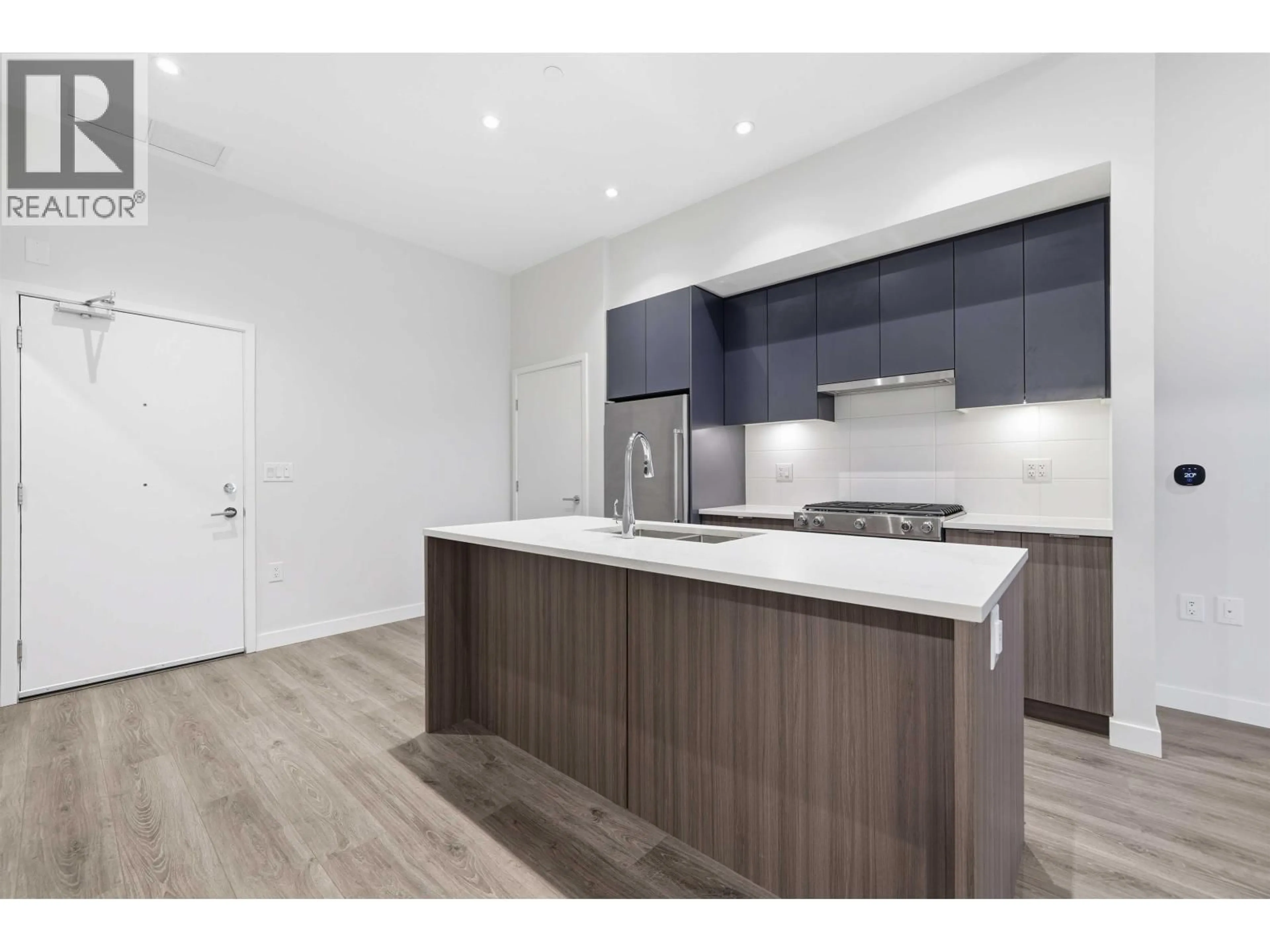 Open concept kitchen, wood/laminate floor for 115 - 3430 KENT AVENUE SOUTH AVENUE, Vancouver British Columbia V5S0G7