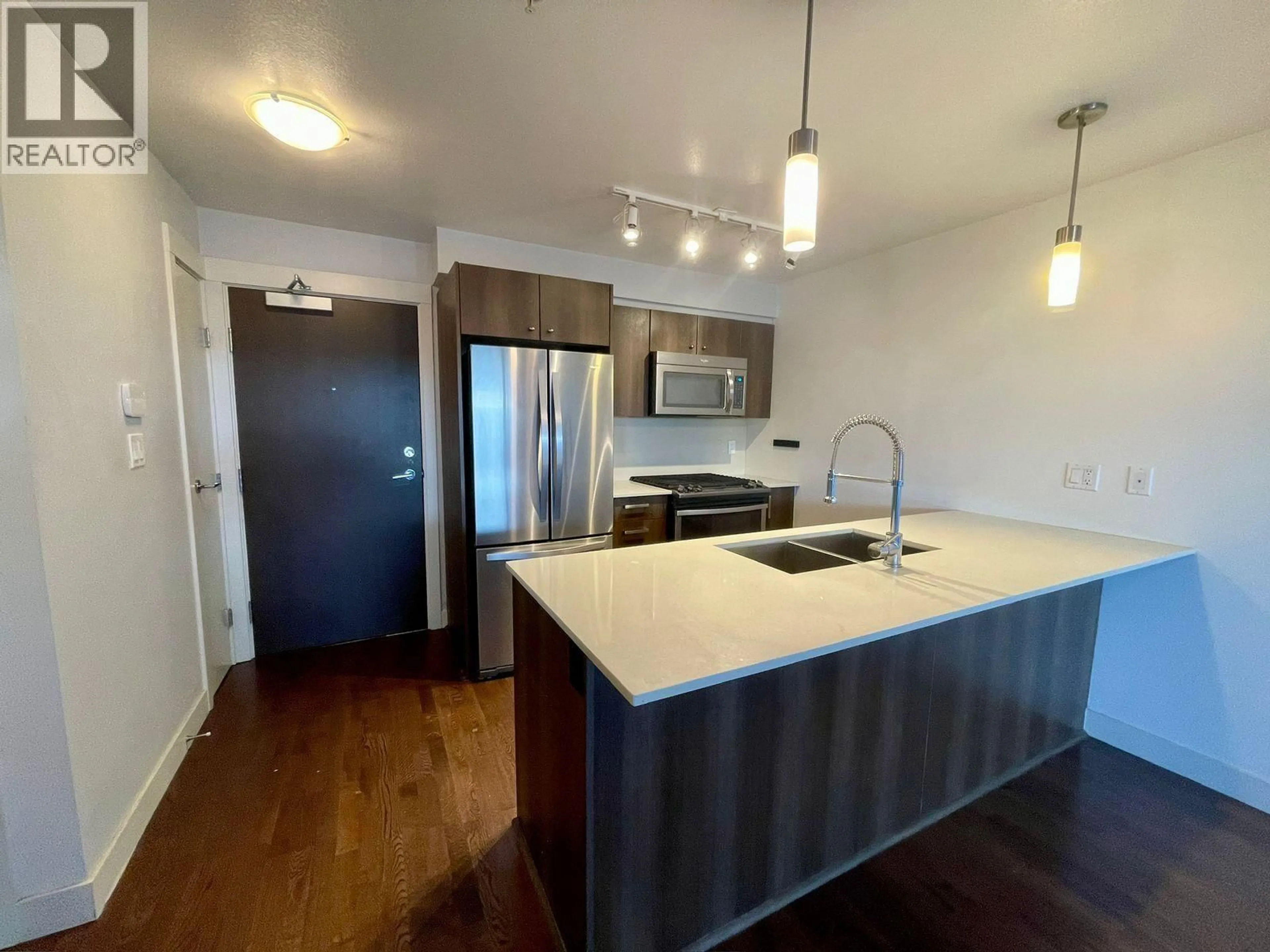 Open concept kitchen, wood/laminate floor for 121 - 7058 14TH AVENUE, Burnaby British Columbia V3N0E6