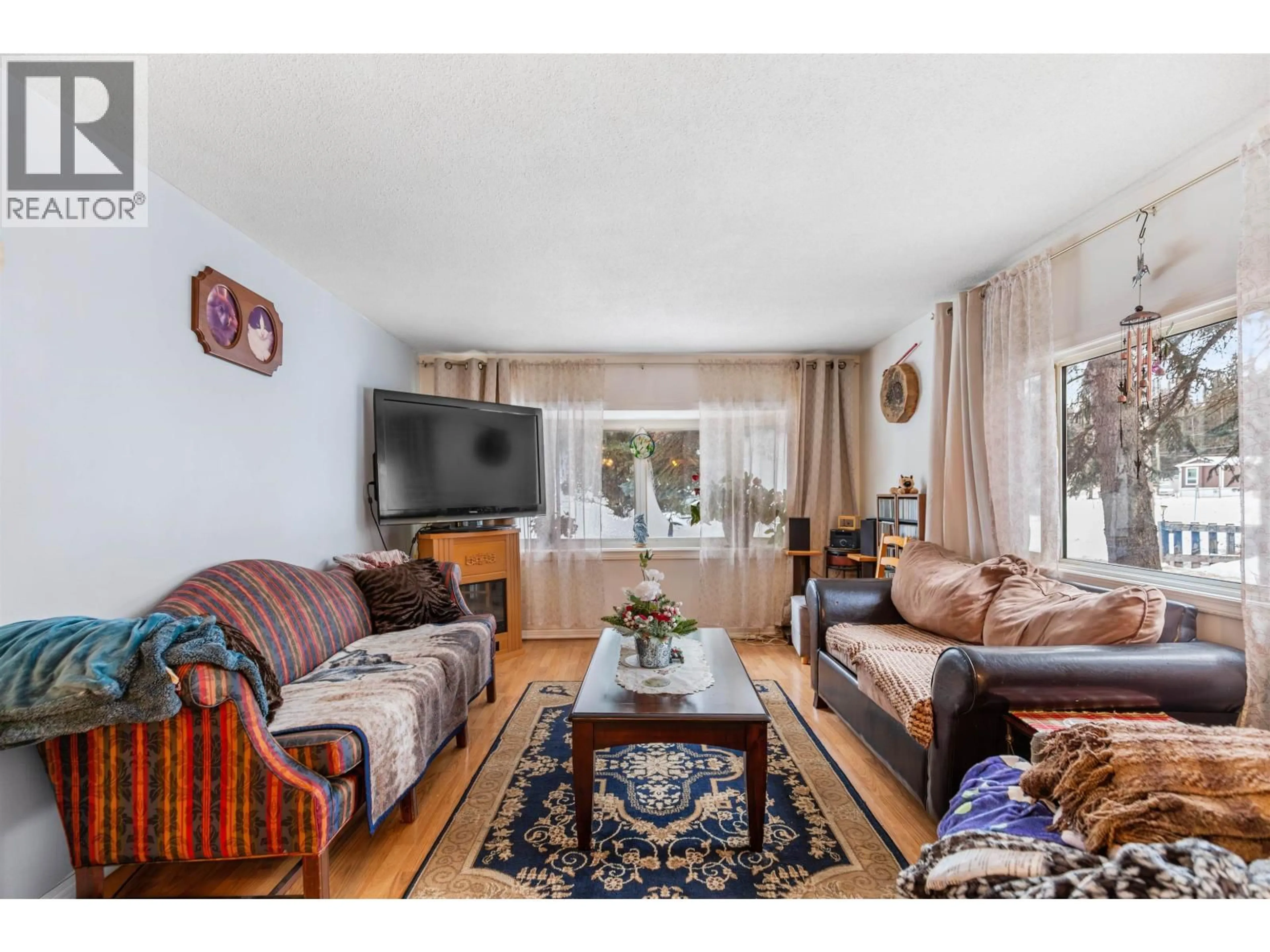 Living room with furniture, wood/laminate floor for 7758 OPAL DRIVE, Prince George British Columbia V2K3L8