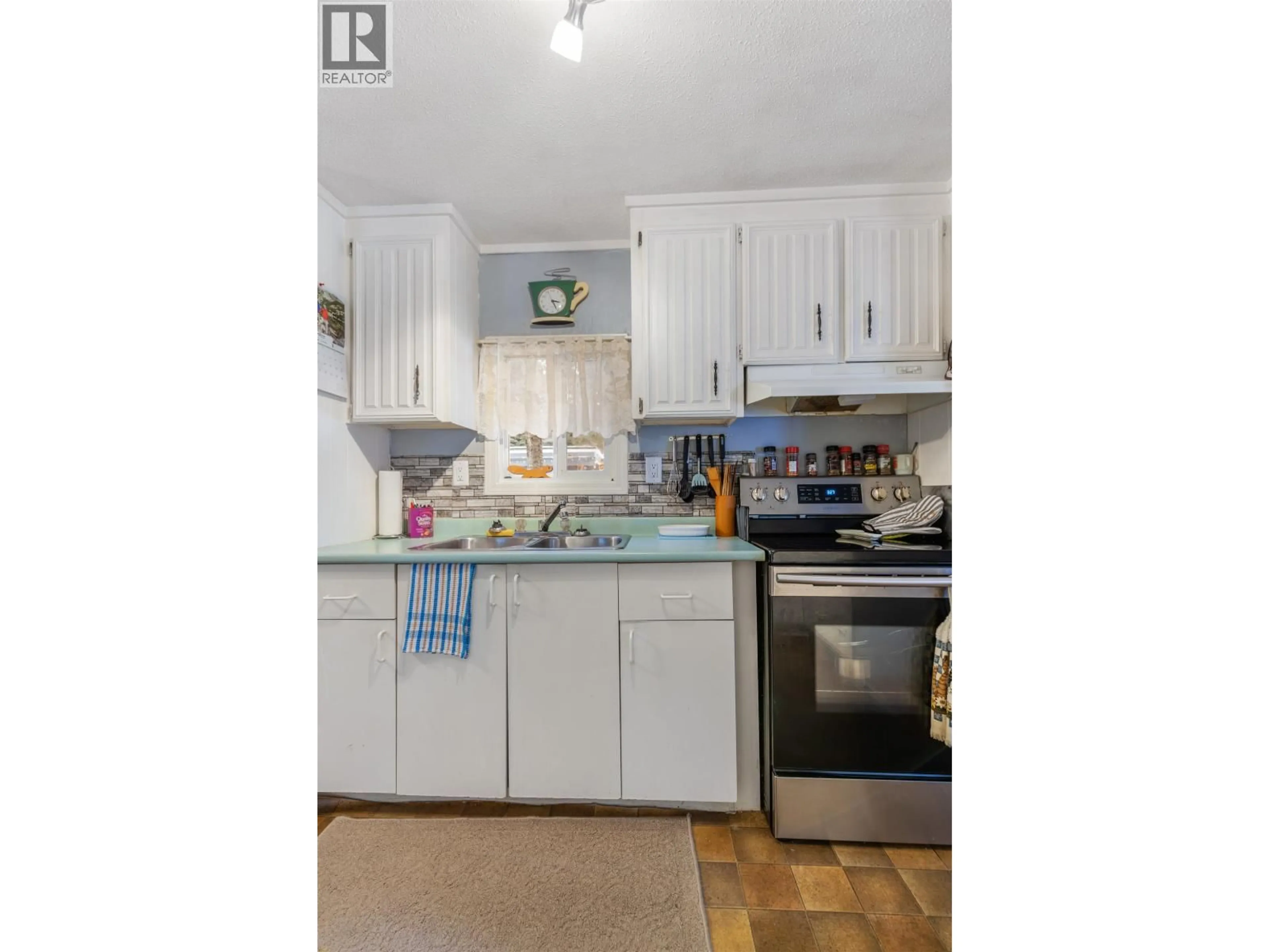 Open concept kitchen, wood/laminate floor for 7758 OPAL DRIVE, Prince George British Columbia V2K3L8