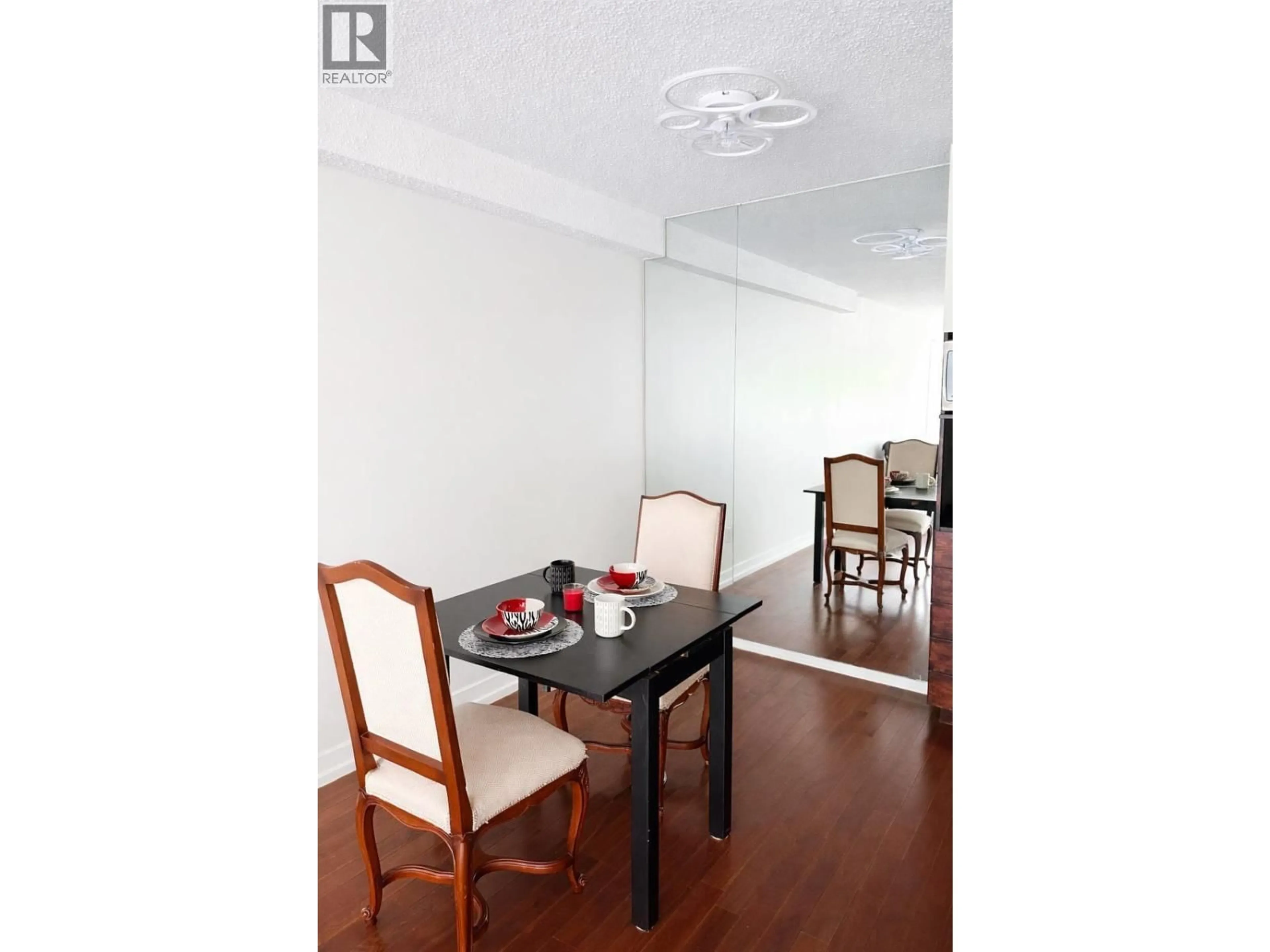 Dining room, wood/laminate floor for 202 - 250 1ST STREET, North Vancouver British Columbia V7M1B4