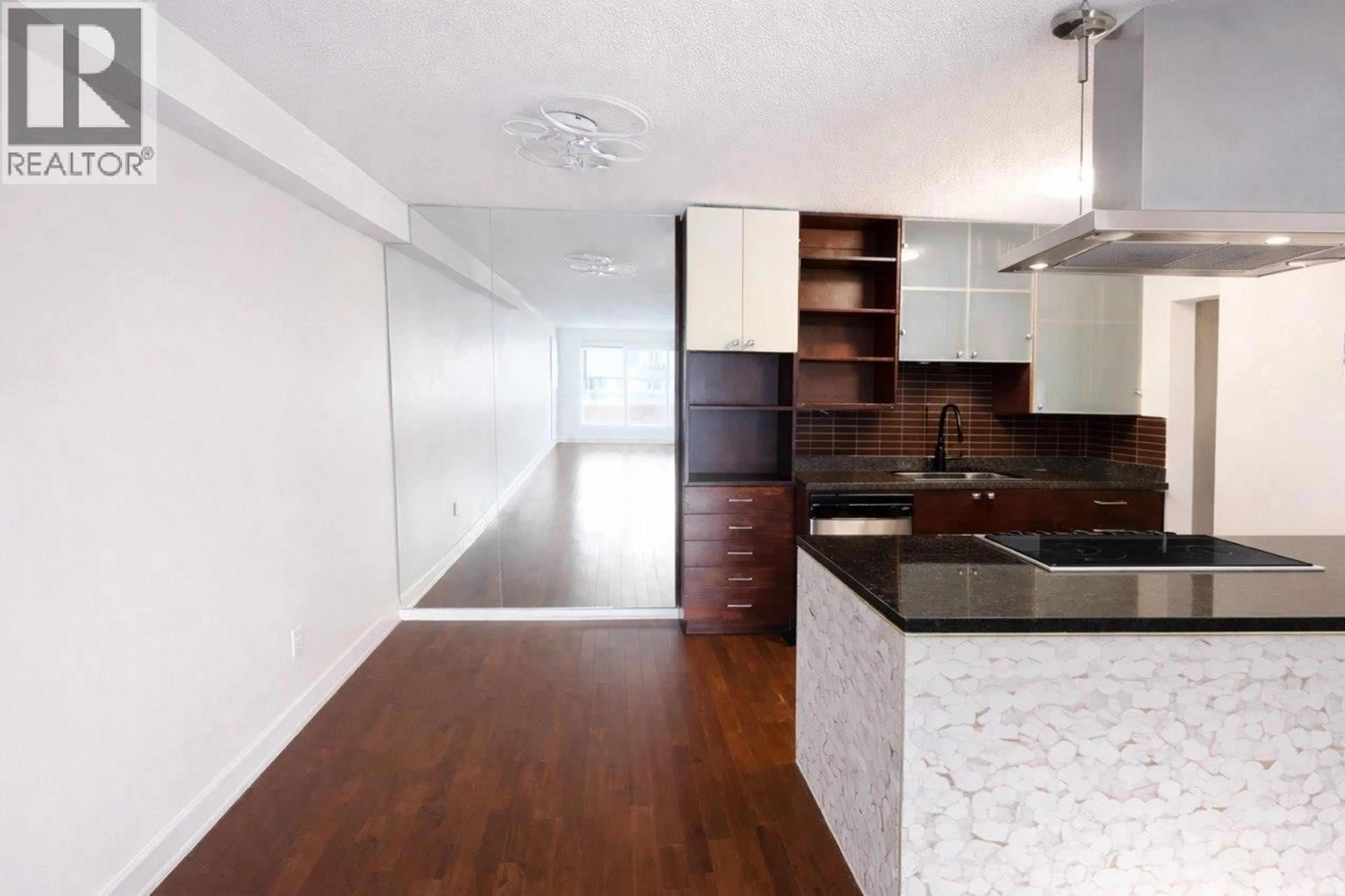 Open concept kitchen, wood/laminate floor for 202 - 250 1ST STREET, North Vancouver British Columbia V7M1B4