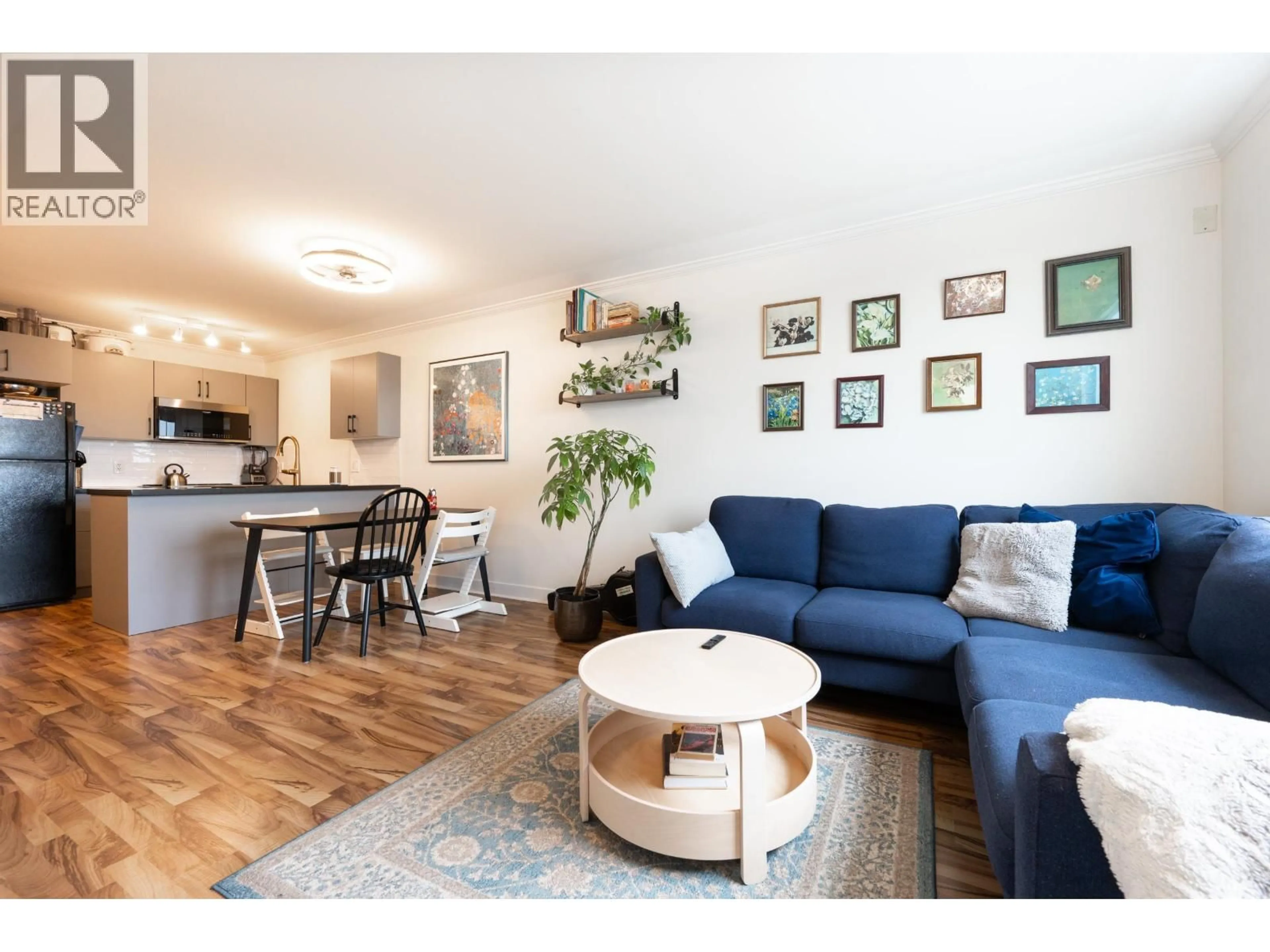 Living room with furniture, wood/laminate floor for PH11 - 2265 HASTINGS STREET, Vancouver British Columbia V5L1V3