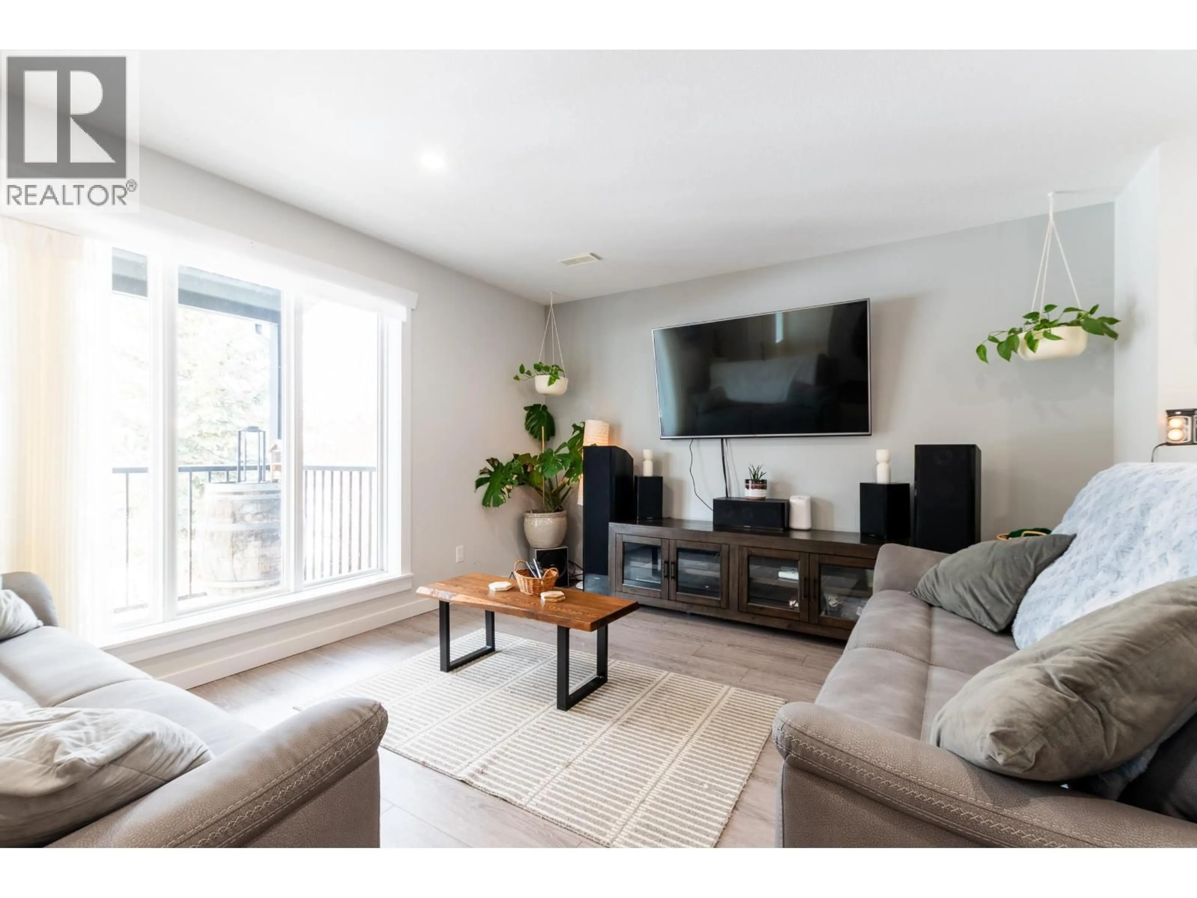 Living room with furniture, wood/laminate floor for 2730 MOYIE STREET, Prince George British Columbia V2L1V8