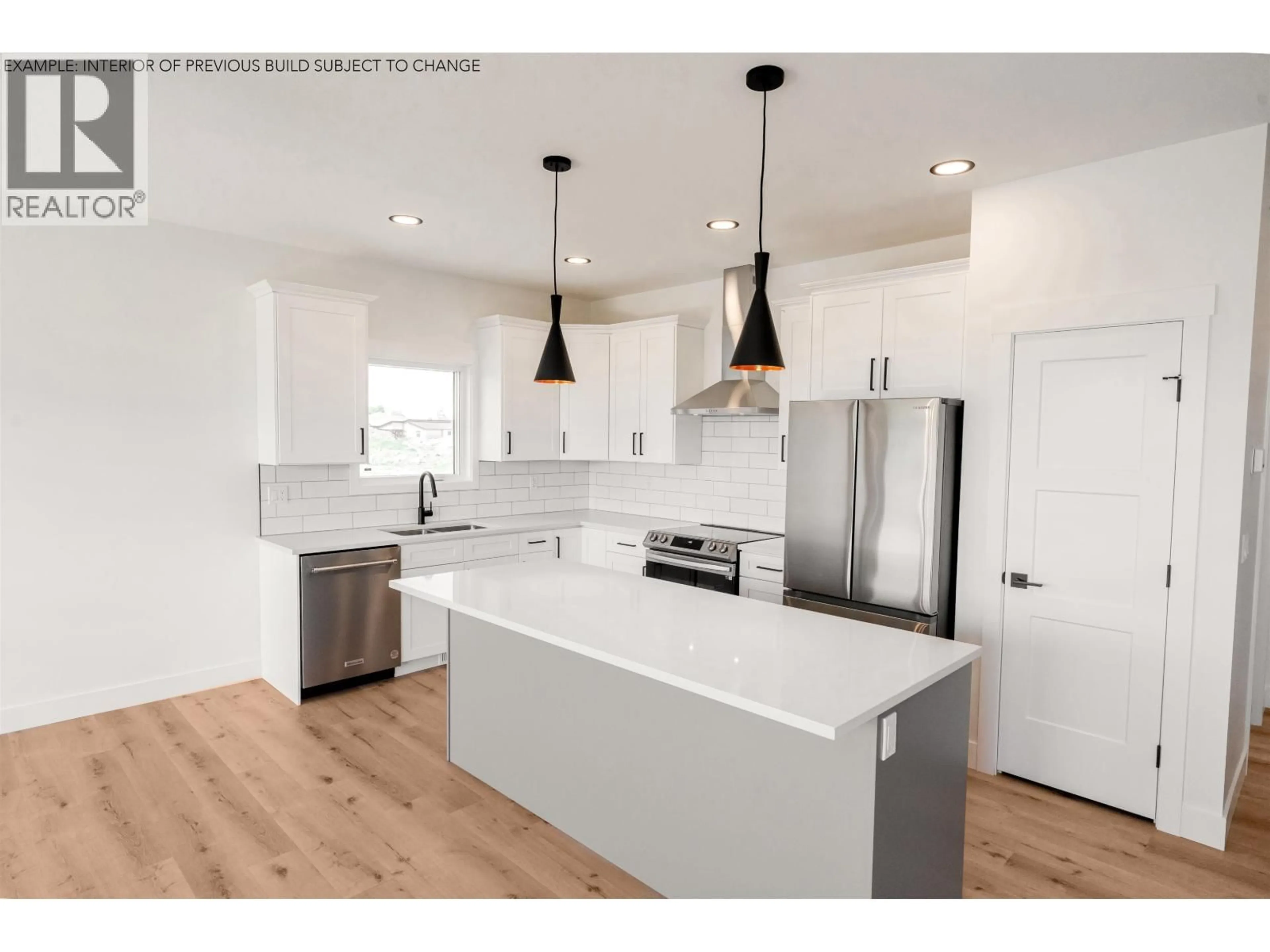 Open concept kitchen, wood/laminate floor for 11604 102A STREET, Fort St. John British Columbia V1J0P8