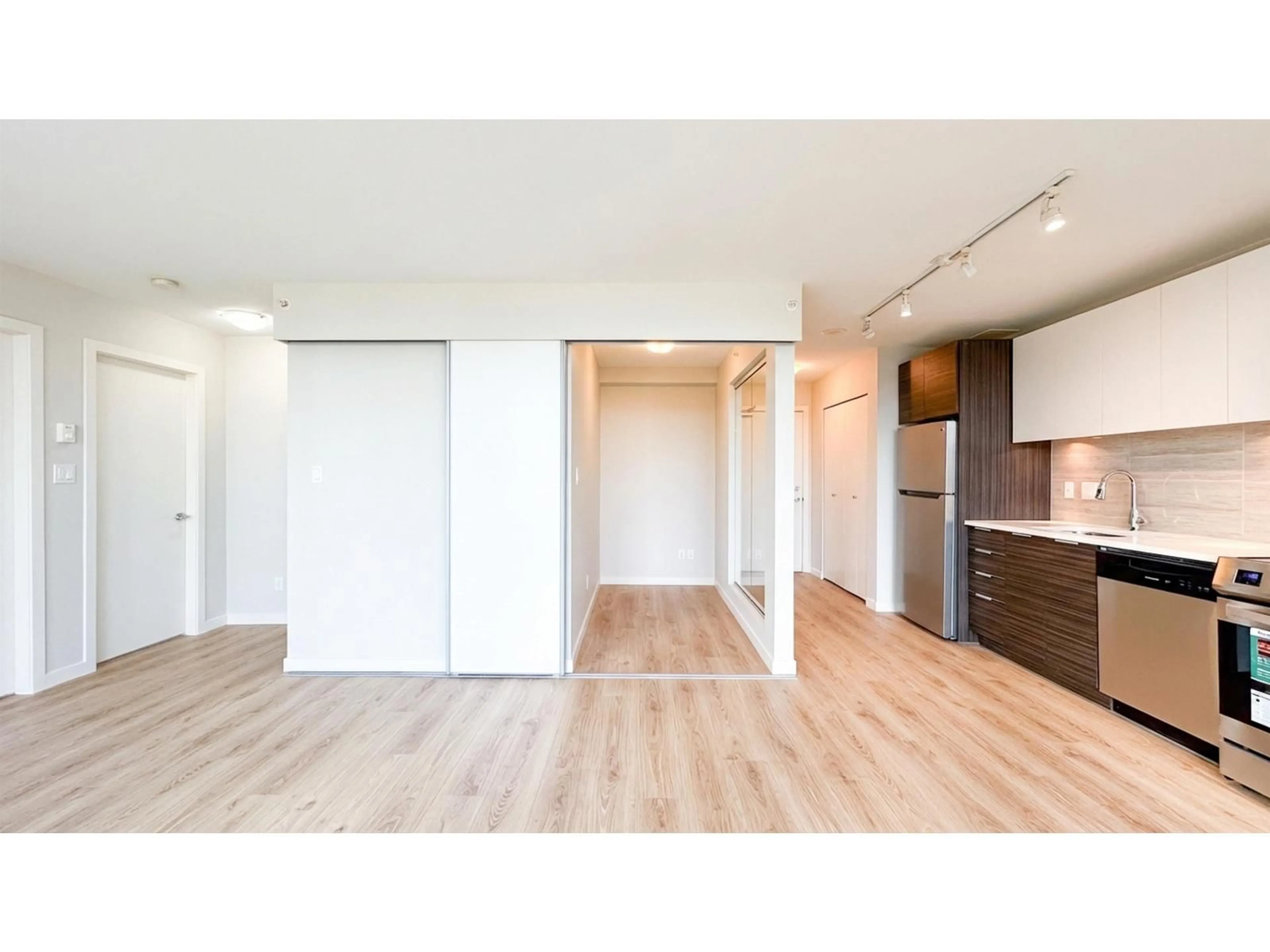 Open concept kitchen, wood/laminate floor for 705 - 13303 CENTRAL AVENUE, Surrey British Columbia V3T0K6