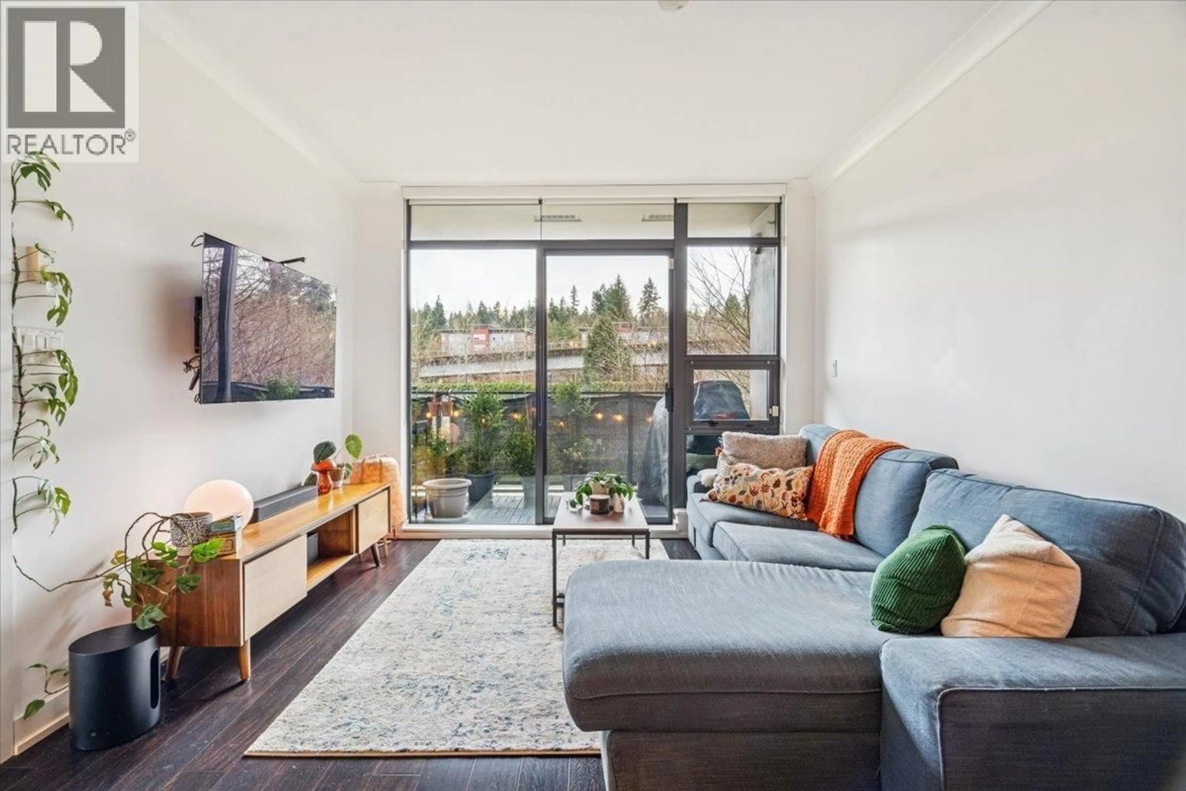 Living room with furniture, wood/laminate floor for 308 - 301 CAPILANO ROAD, Port Moody British Columbia V3H0G6