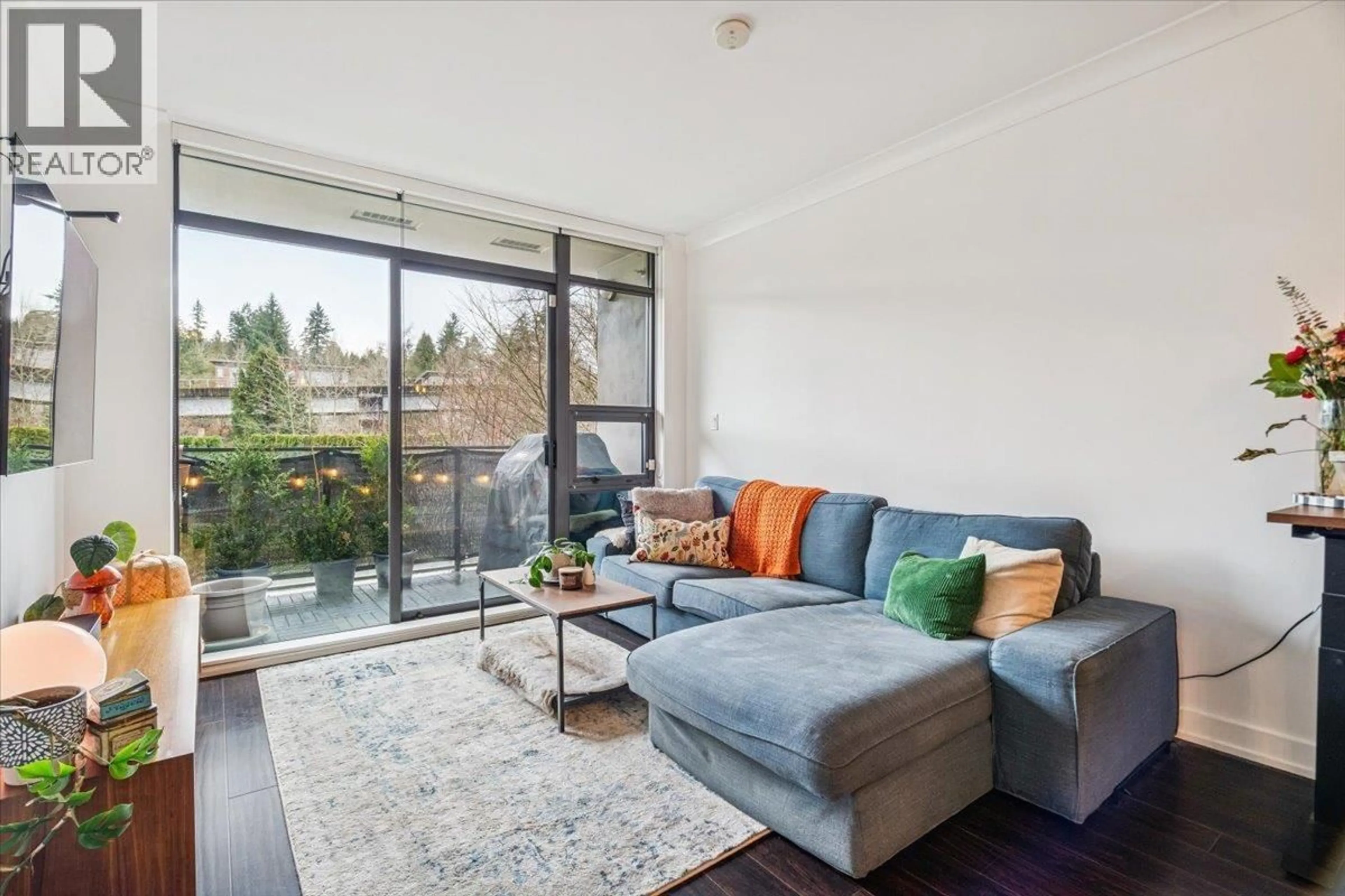 Living room with furniture, wood/laminate floor for 308 - 301 CAPILANO ROAD, Port Moody British Columbia V3H0G6