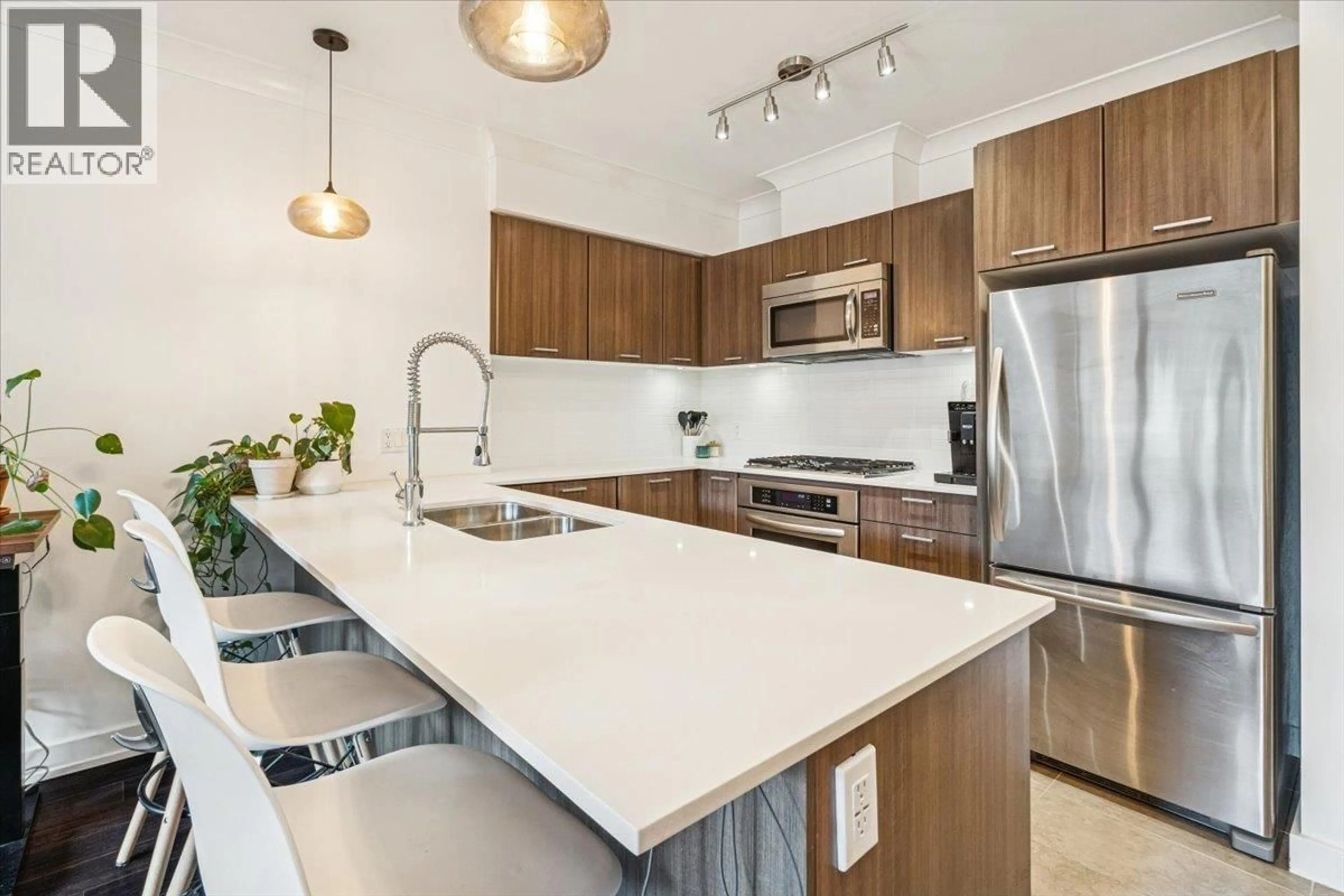 Open concept kitchen, ceramic/tile floor for 308 - 301 CAPILANO ROAD, Port Moody British Columbia V3H0G6