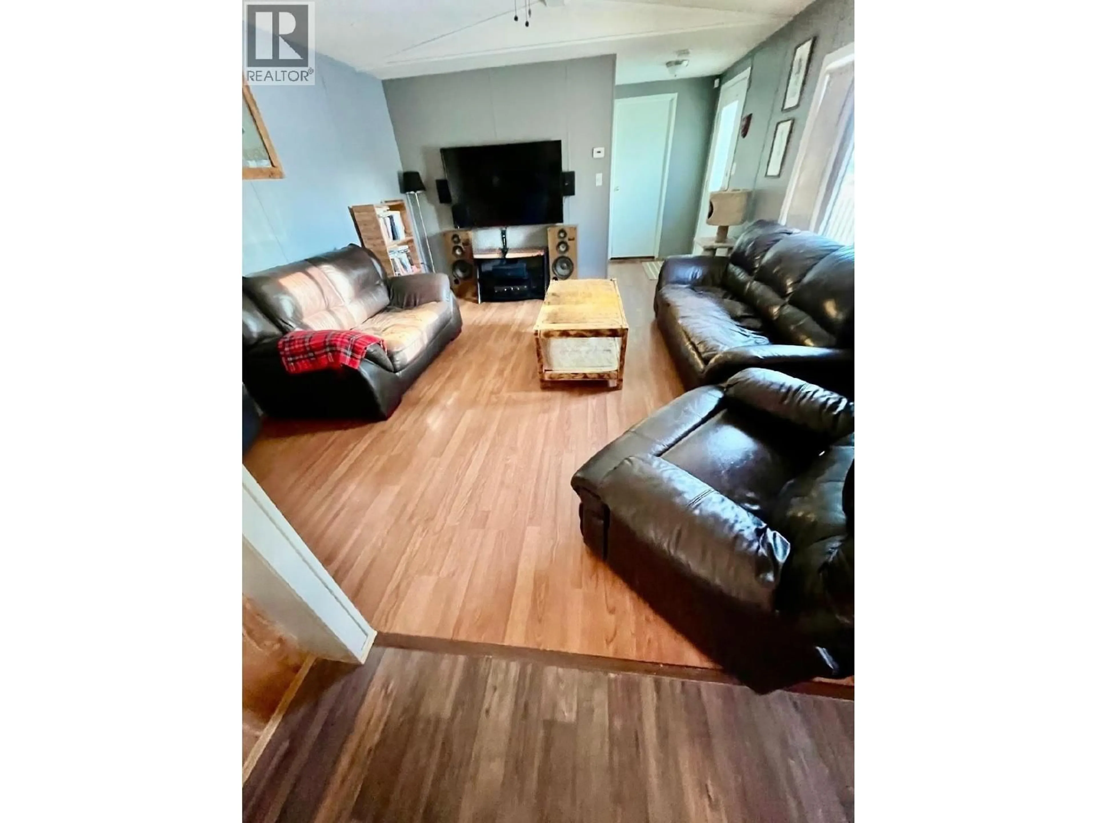 Living room with furniture, wood/laminate floor for 10264 98 STREET, Taylor British Columbia V0C2K0