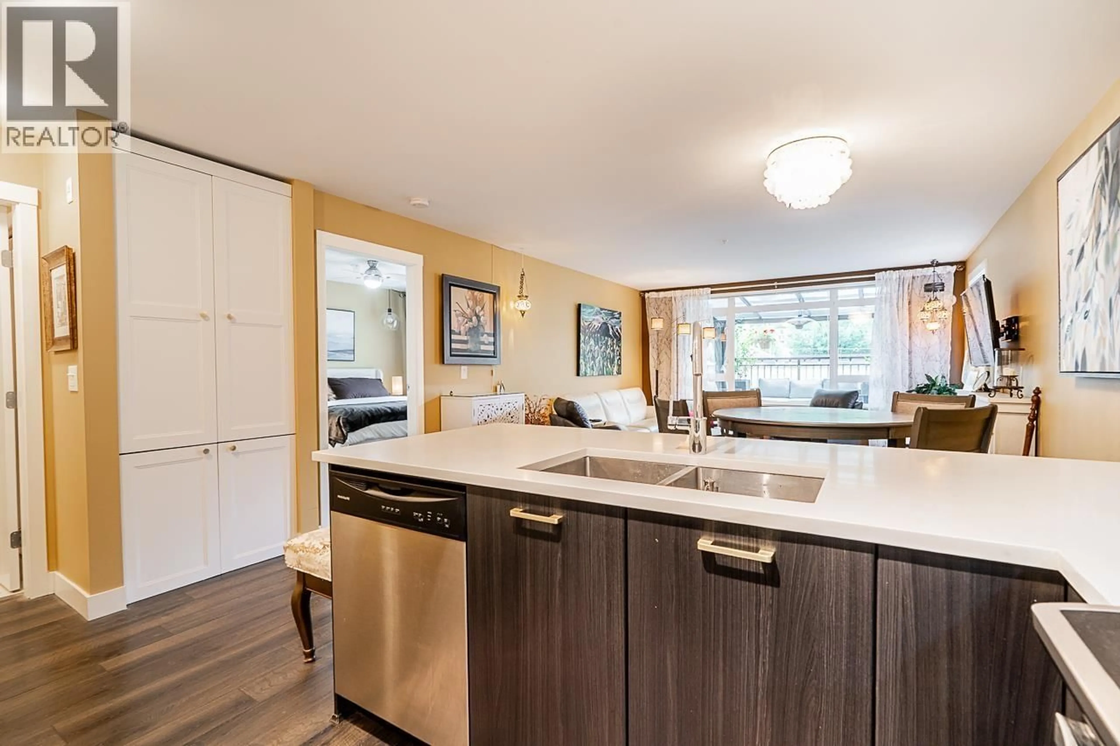 Open concept kitchen, wood/laminate floor for 221 - 2525 CLARKE STREET, Port Moody British Columbia V3H0J3