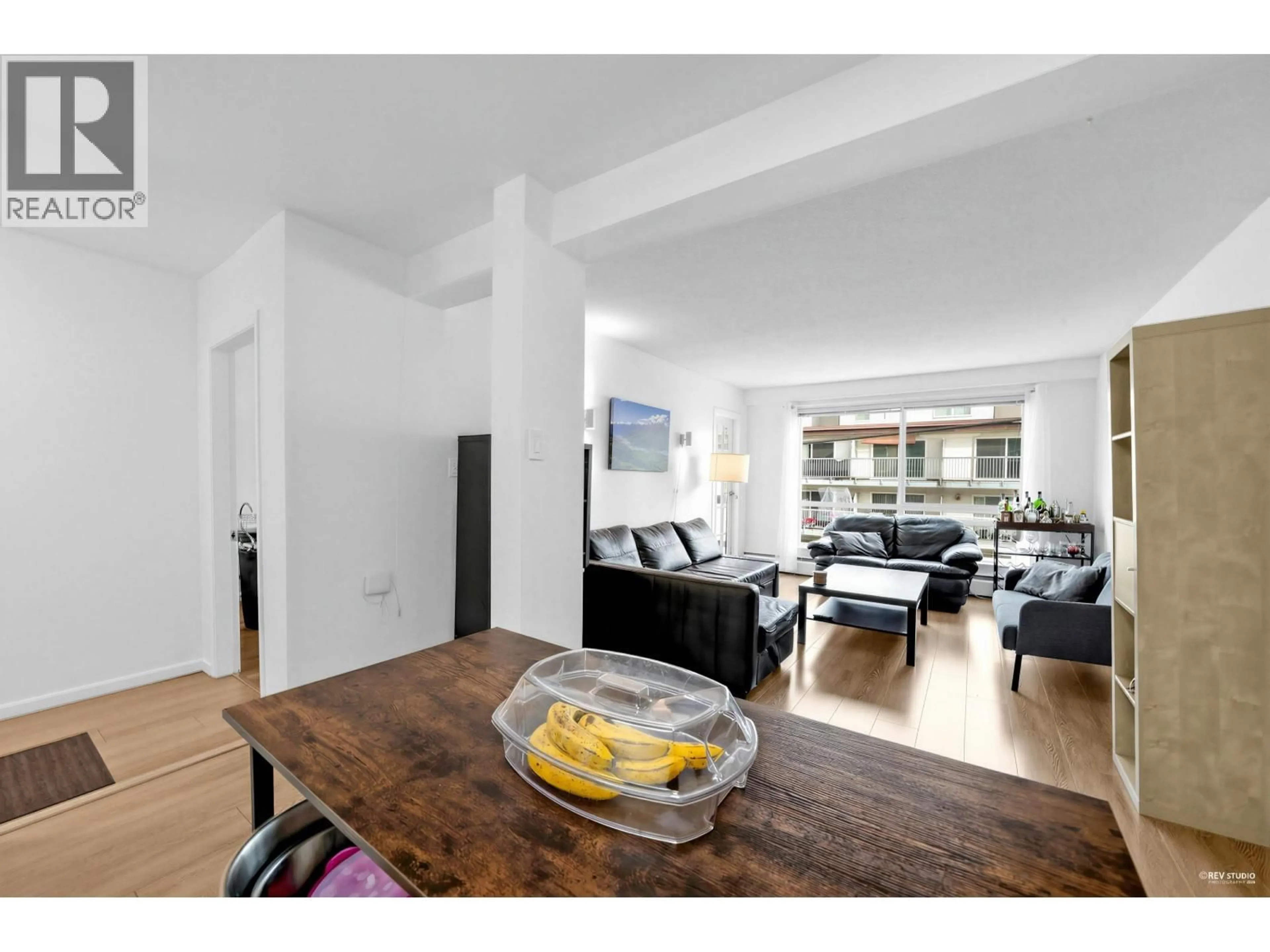 Living room with furniture, wood/laminate floor for 201 - 8680 FREMLIN STREET, Vancouver British Columbia V6P3X3