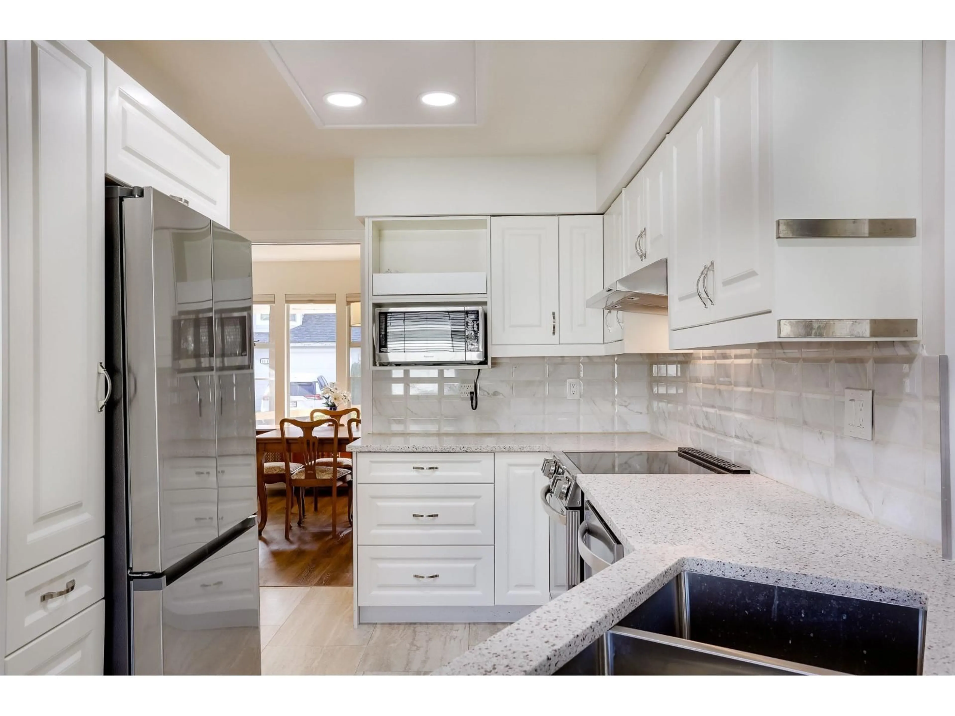 Open concept kitchen, ceramic/tile floor for 112 - 14280 19A AVENUE, Surrey British Columbia V4A8W3