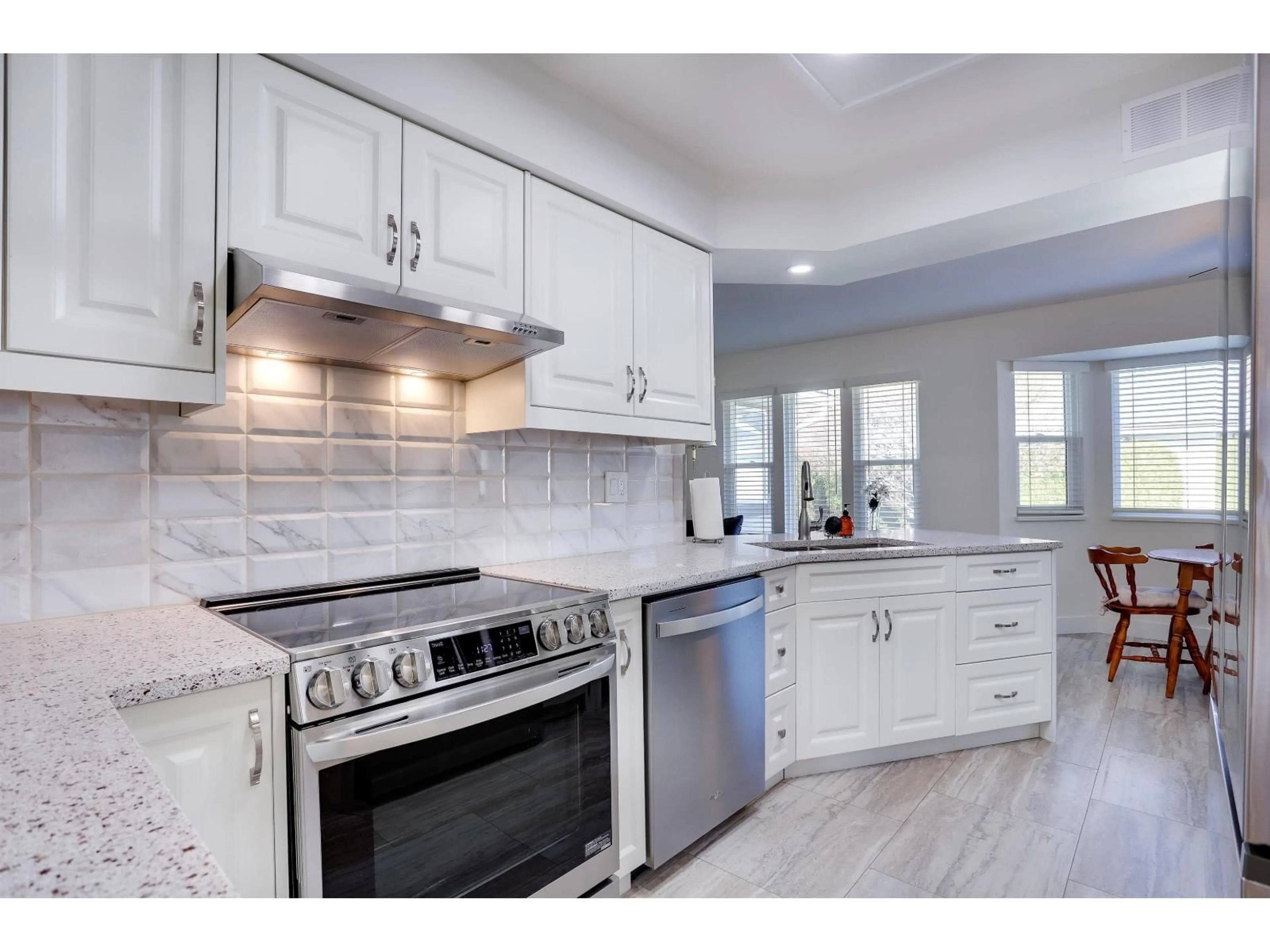 Open concept kitchen, ceramic/tile floor for 112 - 14280 19A AVENUE, Surrey British Columbia V4A8W3