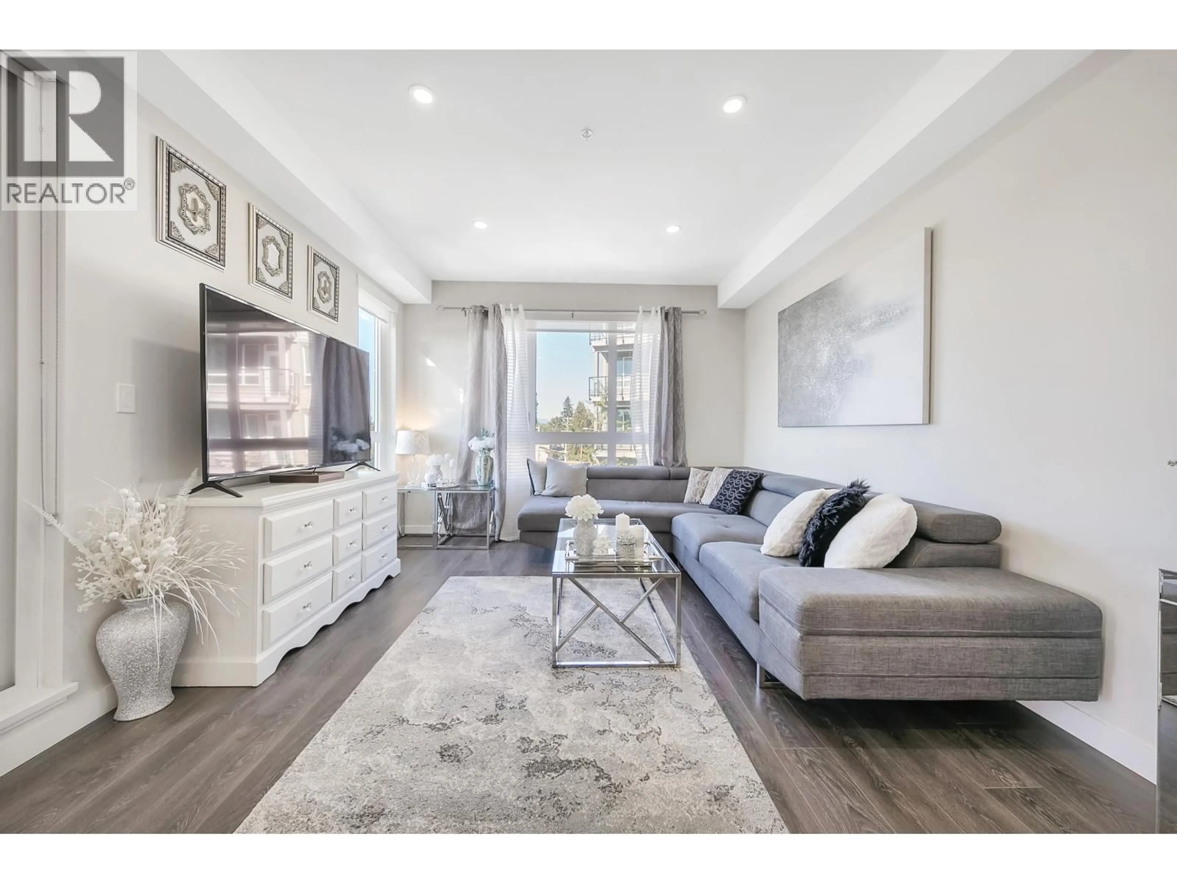 Living room with furniture, wood/laminate floor for 214 - 23233 GILLEY ROAD, Richmond British Columbia V6V1E6