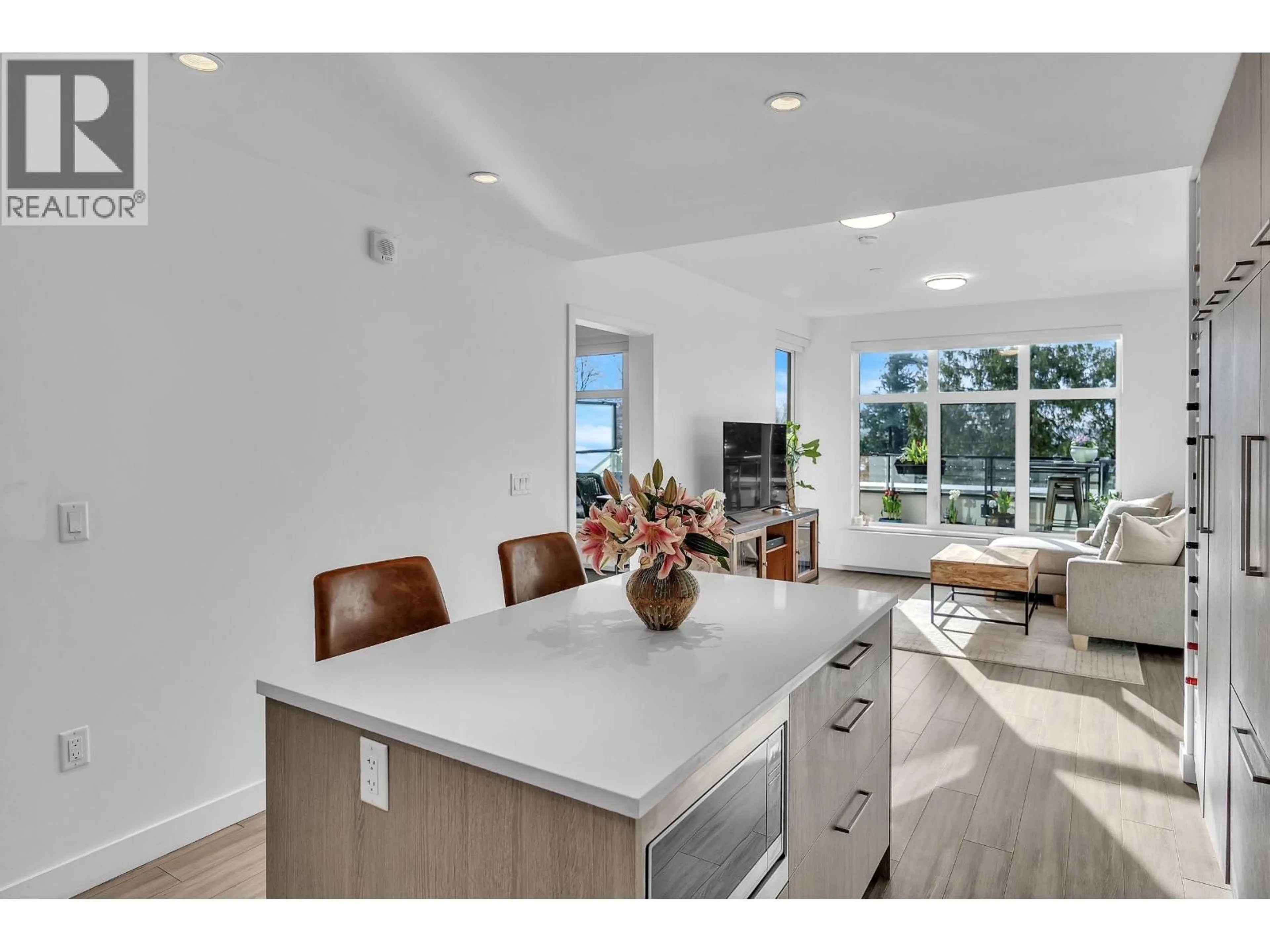 Open concept kitchen, ceramic/tile floor for 205 - 733 3RD STREET, North Vancouver British Columbia V7L1G8