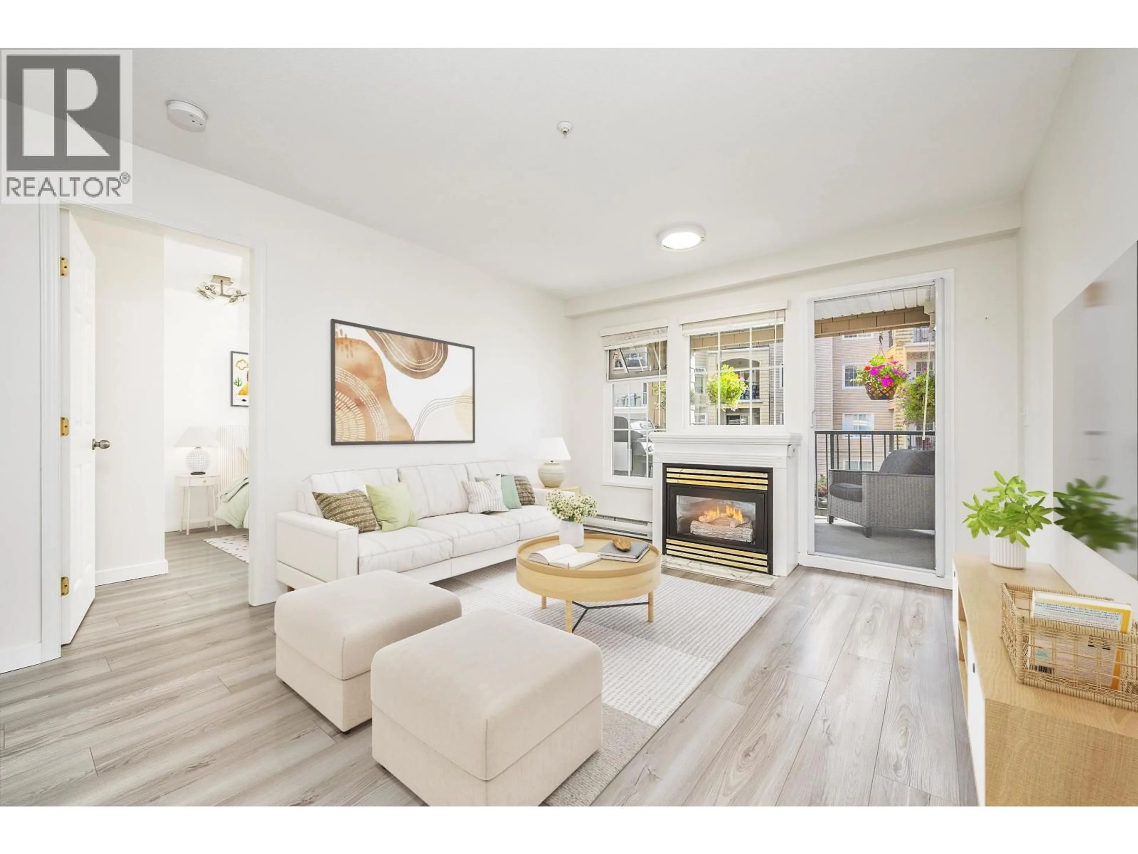 Living room with furniture, wood/laminate floor for 205 - 5518 14TH AVENUE, Delta British Columbia V4M4E0