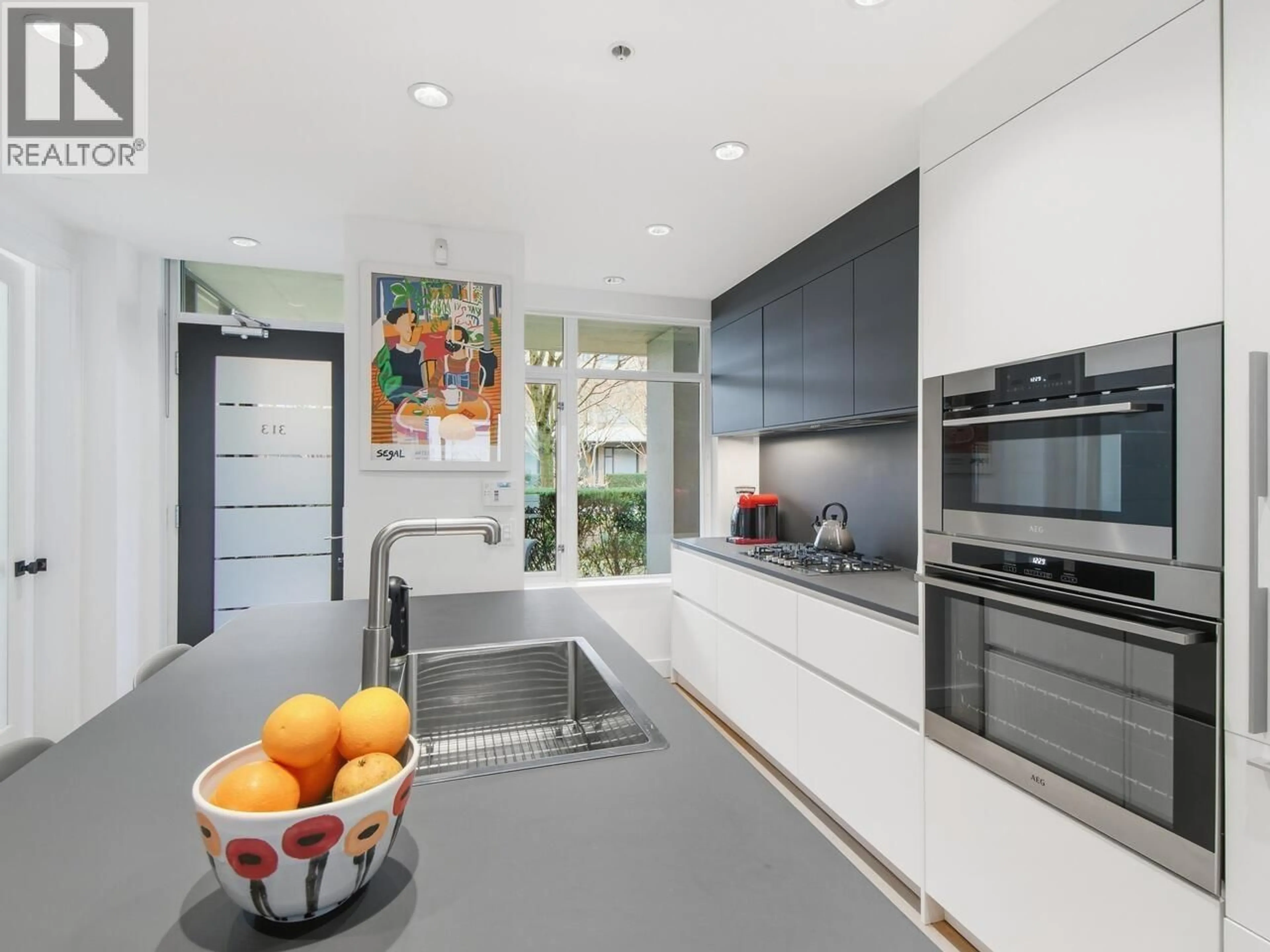 Contemporary kitchen, ceramic/tile floor for 313 - 77 WALTER HARDWICK AVENUE, Vancouver British Columbia V5Y0C8