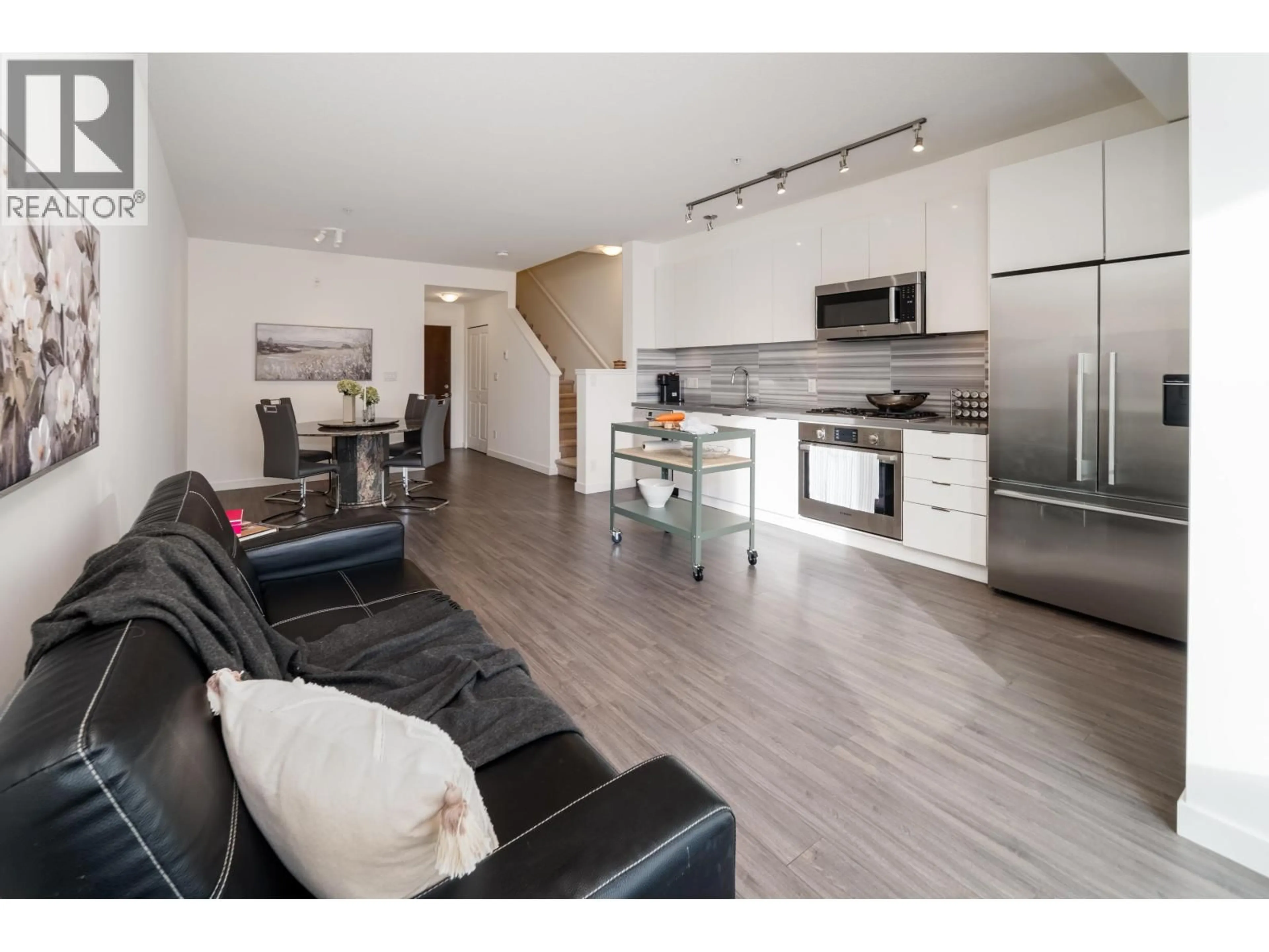 Open concept kitchen, wood/laminate floor for 301 - 3138 RIVERWALK AVENUE, Vancouver British Columbia V5S0B6