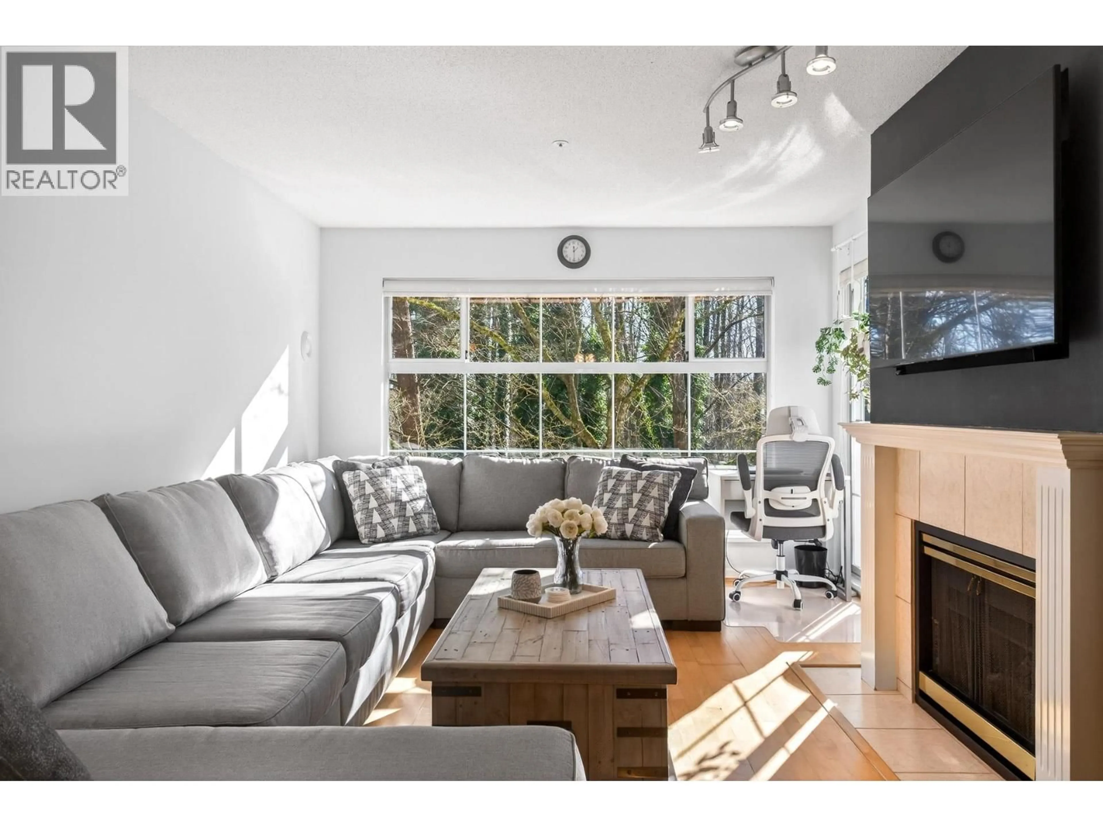 Living room with furniture, wood/laminate floor for 218 - 2678 DIXON STREET, Port Coquitlam British Columbia V3C6L7