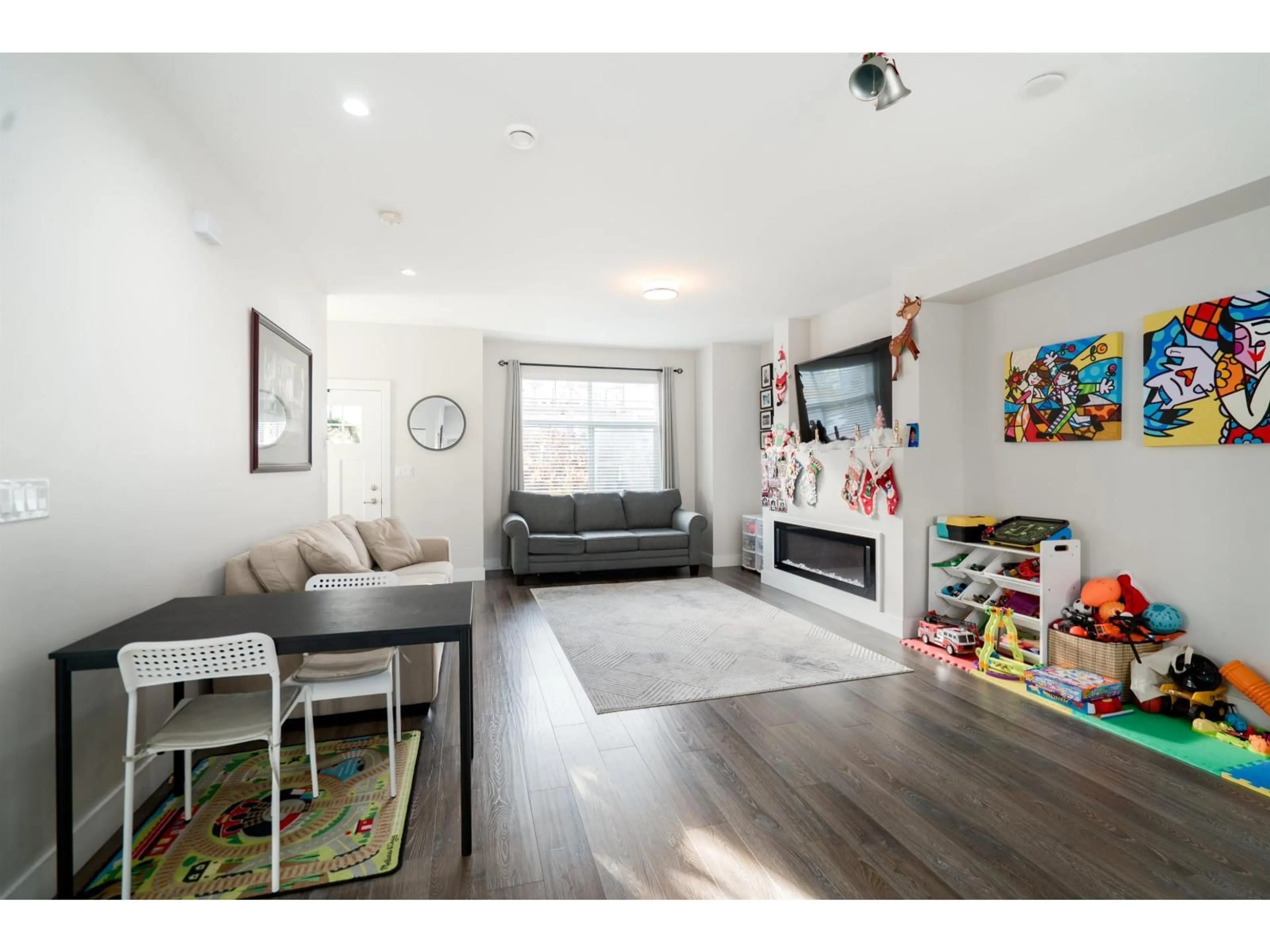 Living room with furniture, wood/laminate floor for 57 - 14541 WINTER CRESCENT, Surrey British Columbia V4P0G5