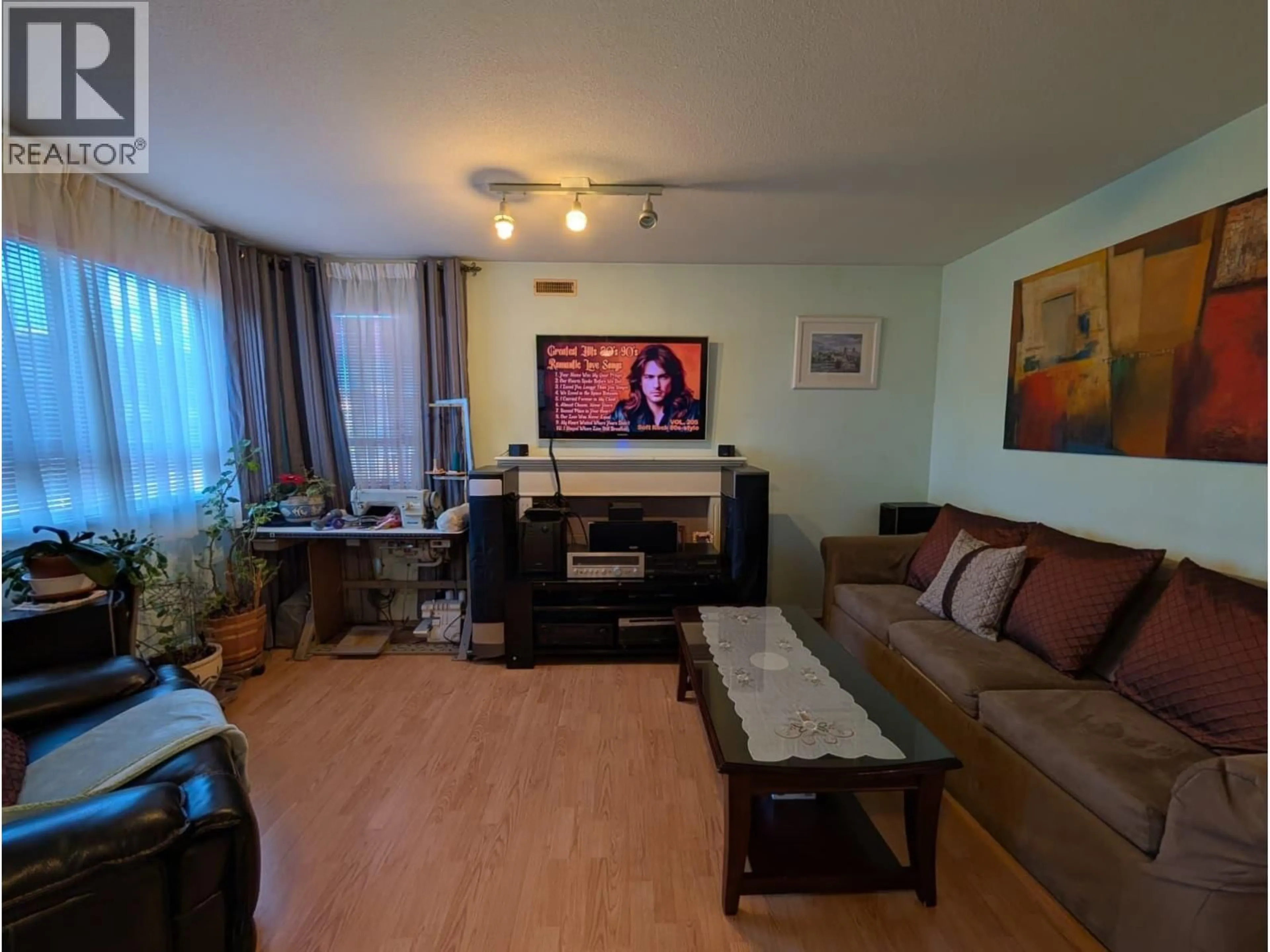 Living room with furniture, wood/laminate floor for 203 - 4950 JOYCE STREET, Vancouver British Columbia V5R4G6