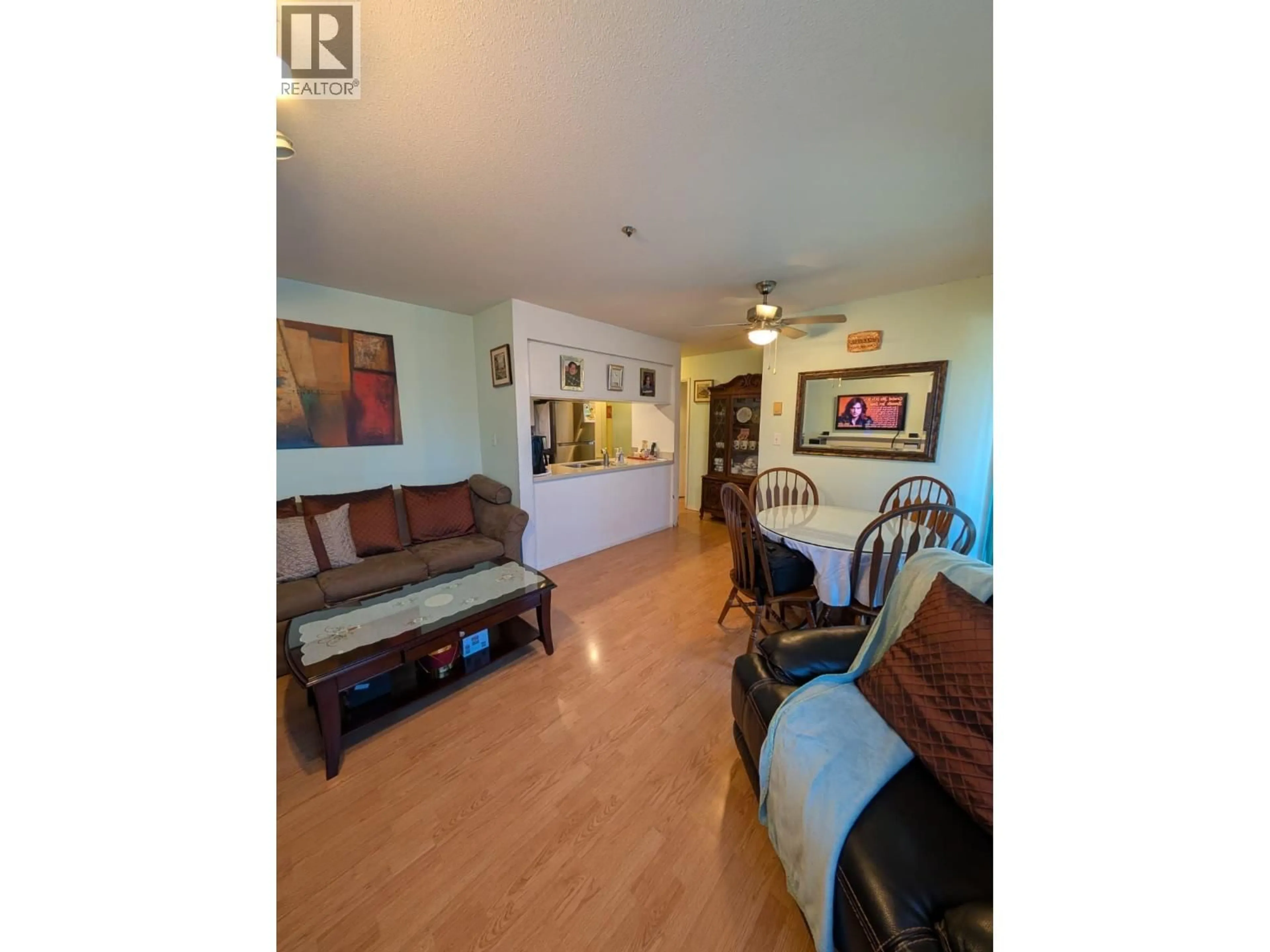 Living room with furniture, wood/laminate floor for 203 - 4950 JOYCE STREET, Vancouver British Columbia V5R4G6