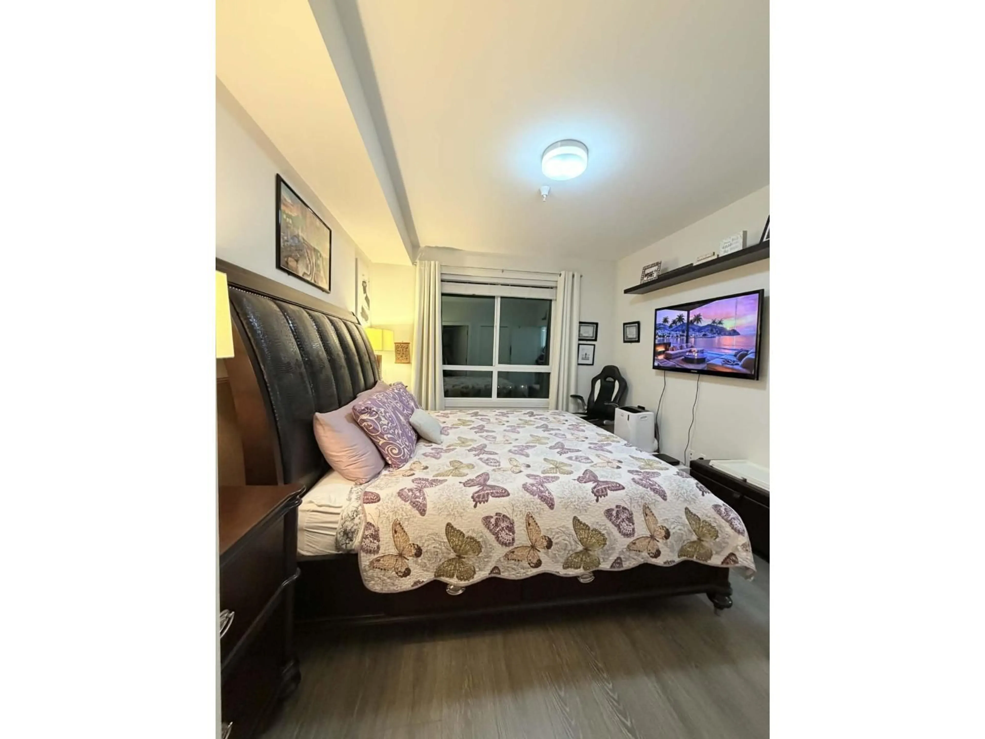 Bedroom with bed, wood/laminate floor for 407 - 15351 101 AVENUE, Surrey British Columbia V3R0G2