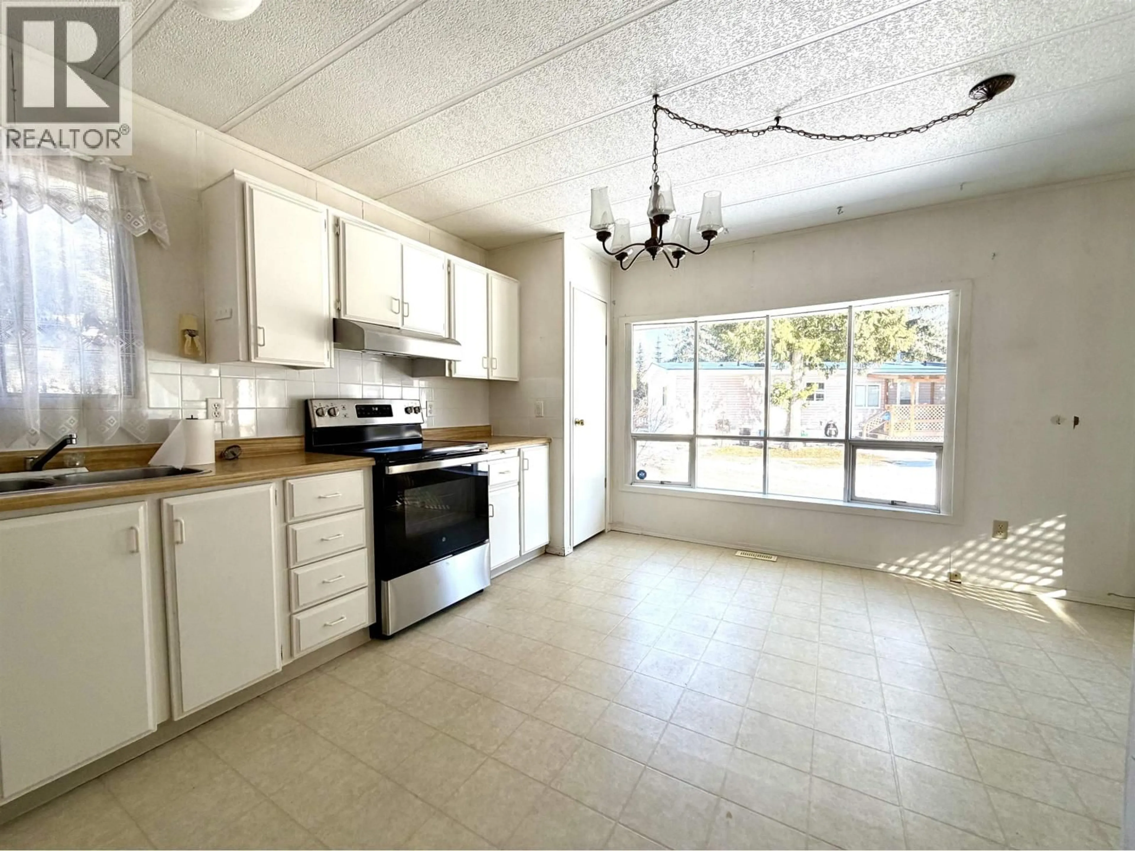 Open concept kitchen, ceramic/tile floor for 18 - 4619 QUEENSWAY DRIVE, Terrace British Columbia V8G3X4