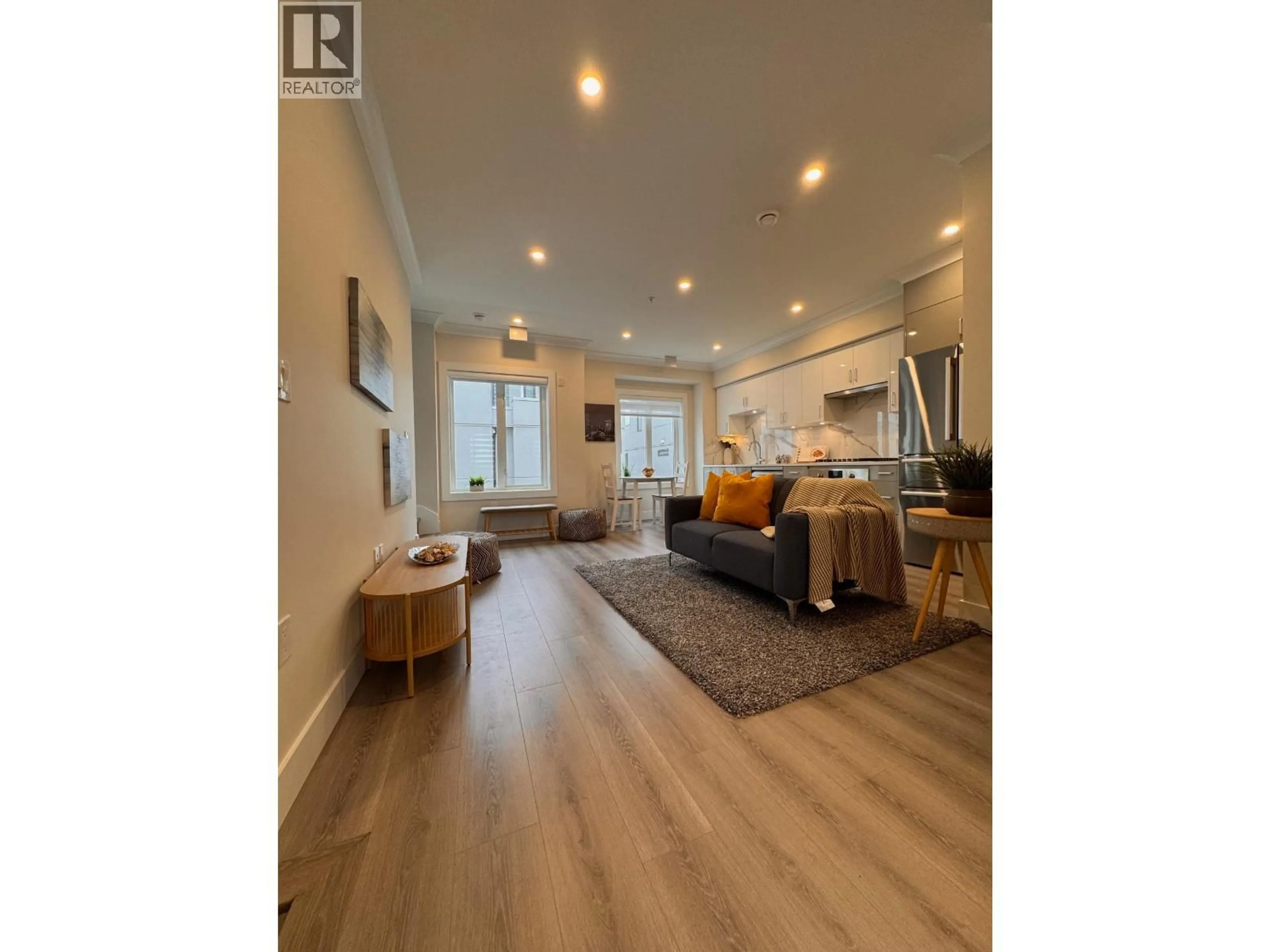 Living room with furniture, wood/laminate floor for 8319 FRENCH STREET, Vancouver British Columbia V6P4W3