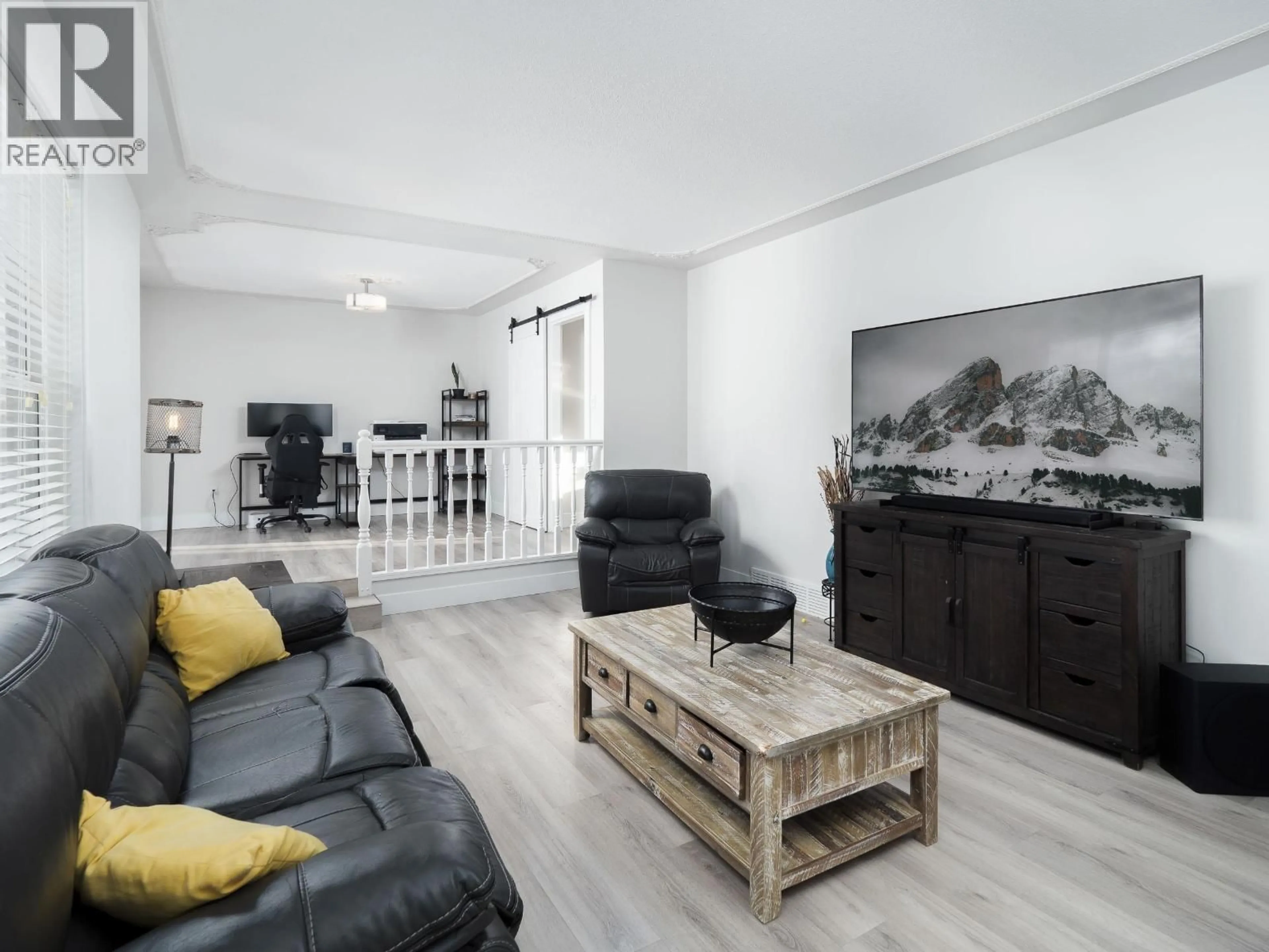 Living room with furniture, wood/laminate floor for 6532 RAMPART PLACE, Prince George British Columbia V2K4H4