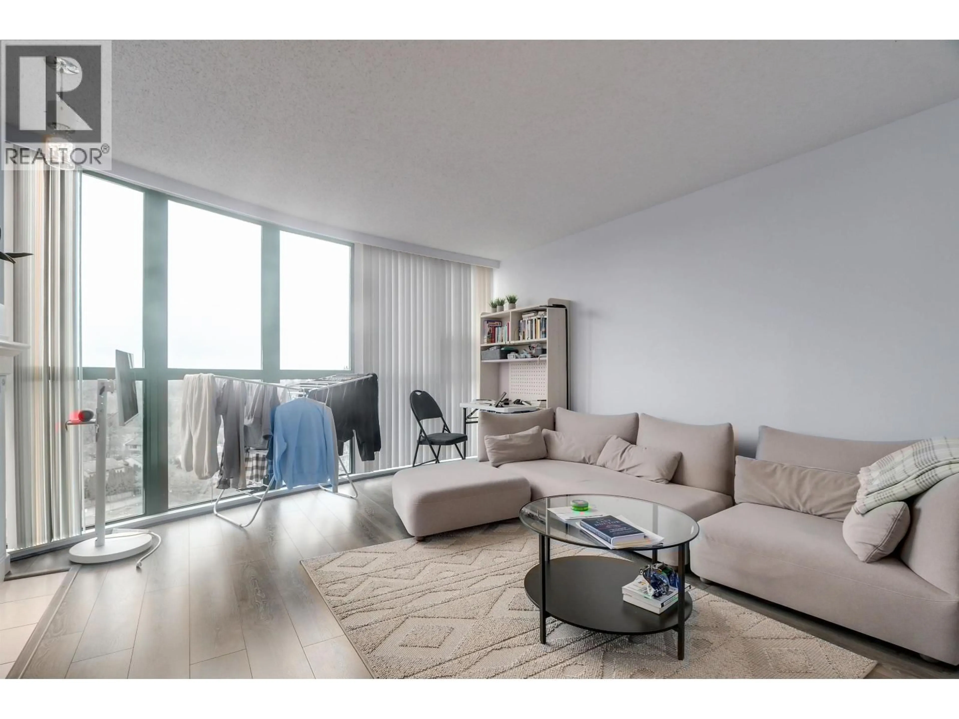 Living room with furniture, wood/laminate floor for 1004 - 1190 PIPELINE ROAD, Coquitlam British Columbia V3B7T9