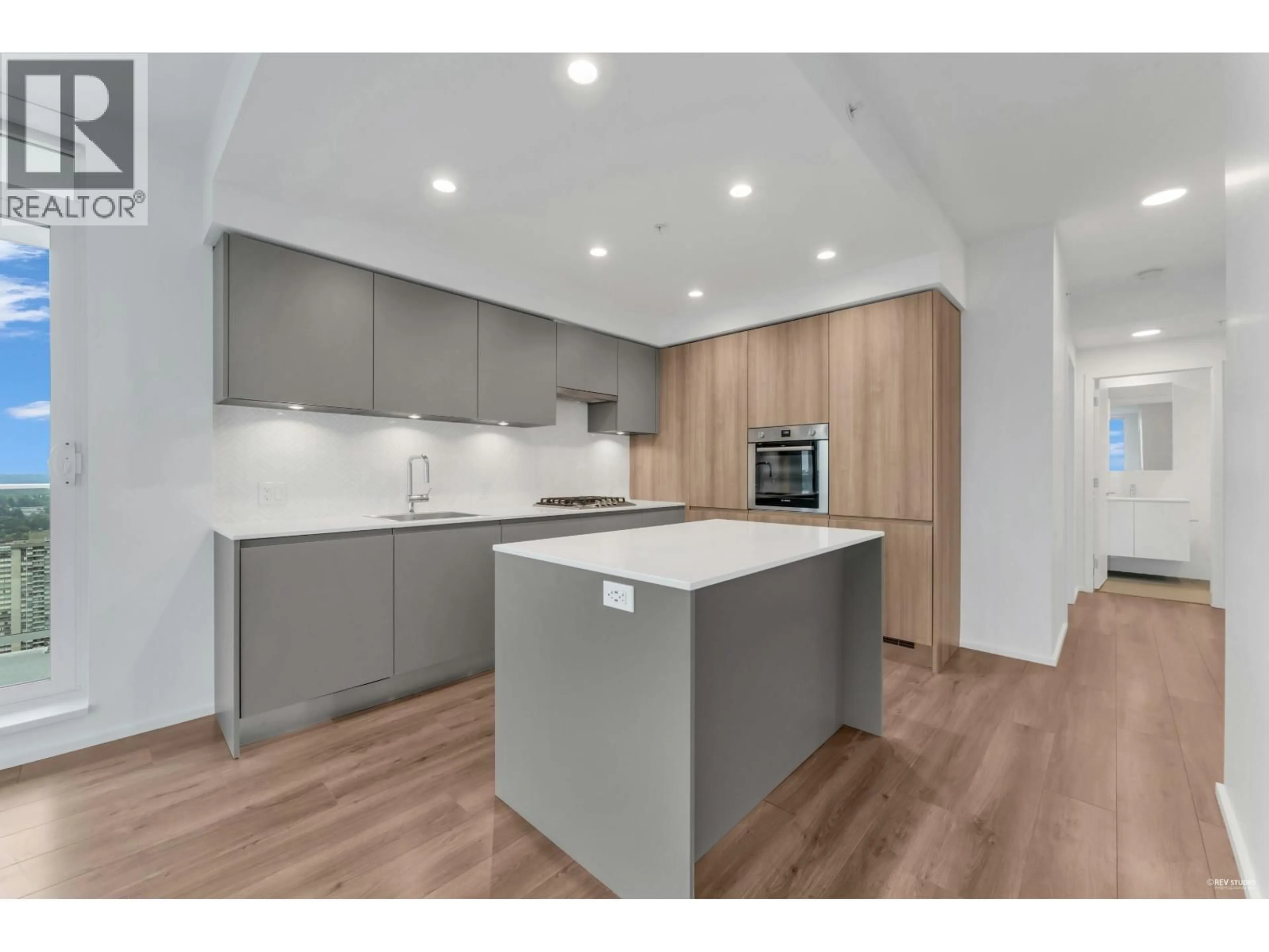 Open concept kitchen, wood/laminate floor for 3407 - 3833 EVERGREEN PLACE, Burnaby British Columbia V3J0M2