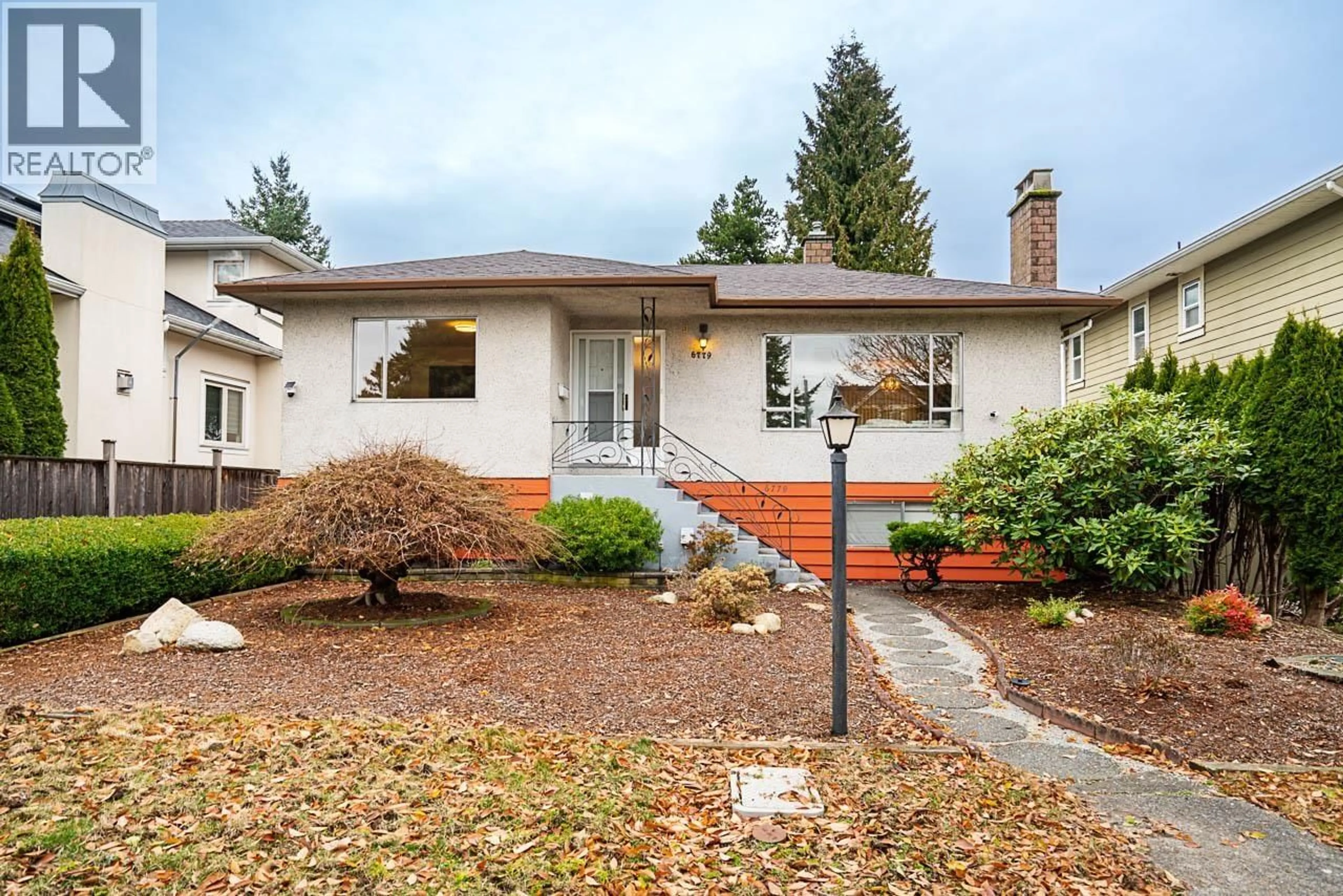 Home with vinyl exterior material, street for 6779 ELWELL STREET, Burnaby British Columbia V5E1K2