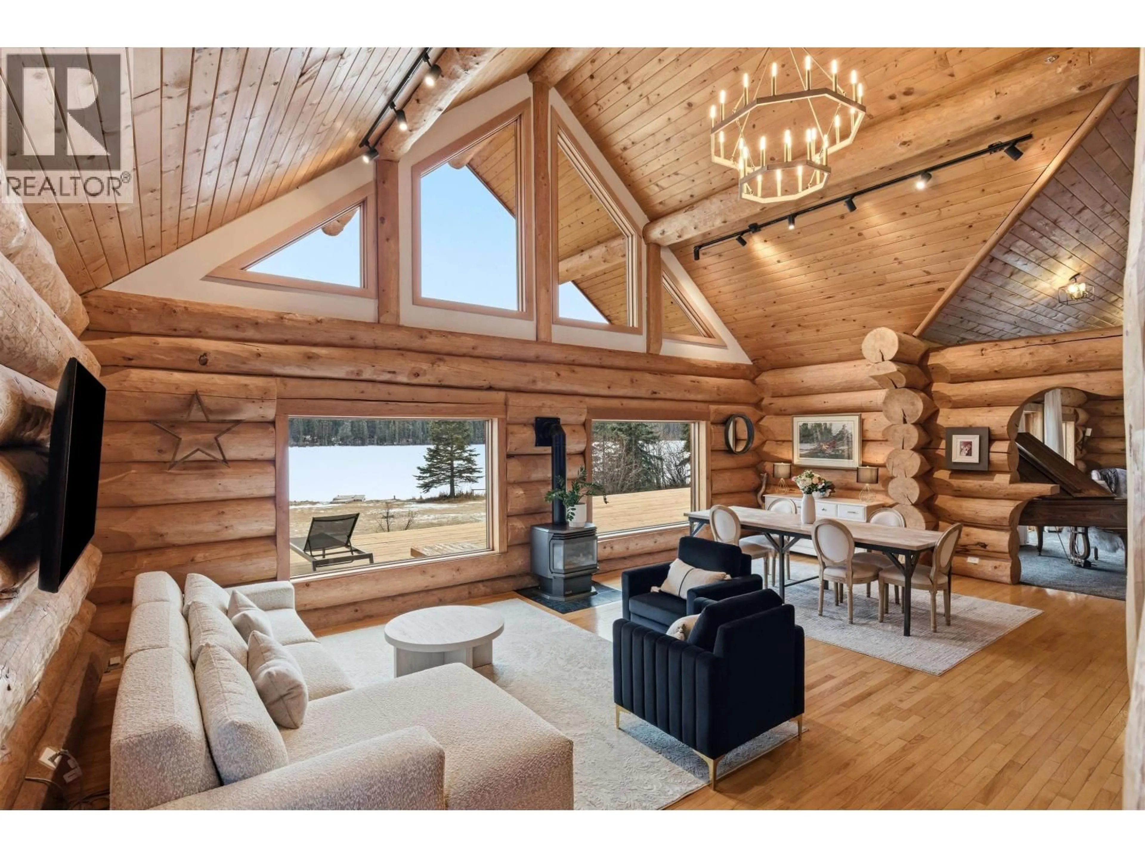 Living room with furniture, wood/laminate floor for 3350 LIKELY ROAD, 150 Mile House British Columbia V0K2G0