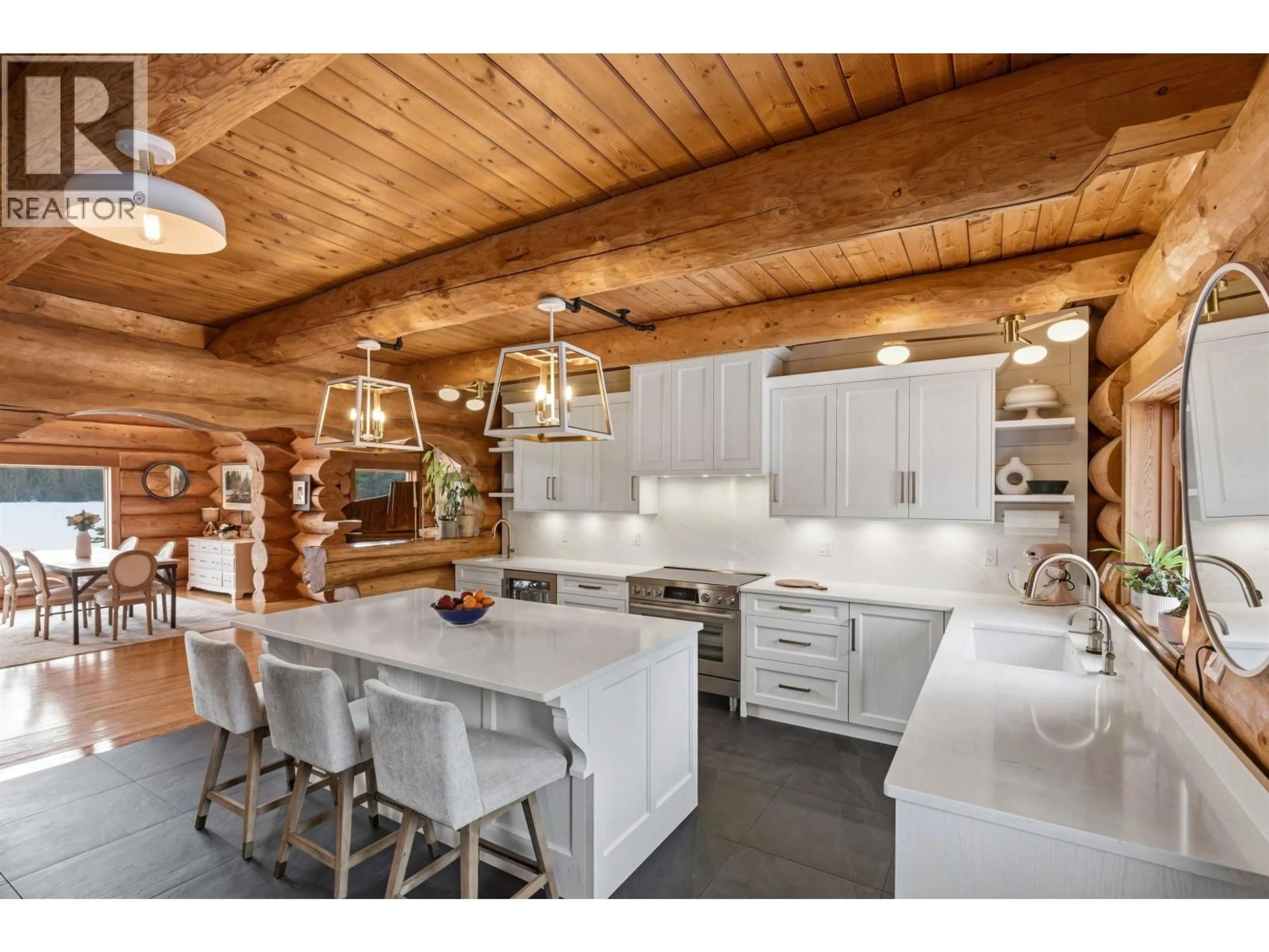 Open concept kitchen, wood/laminate floor for 3350 LIKELY ROAD, 150 Mile House British Columbia V0K2G0