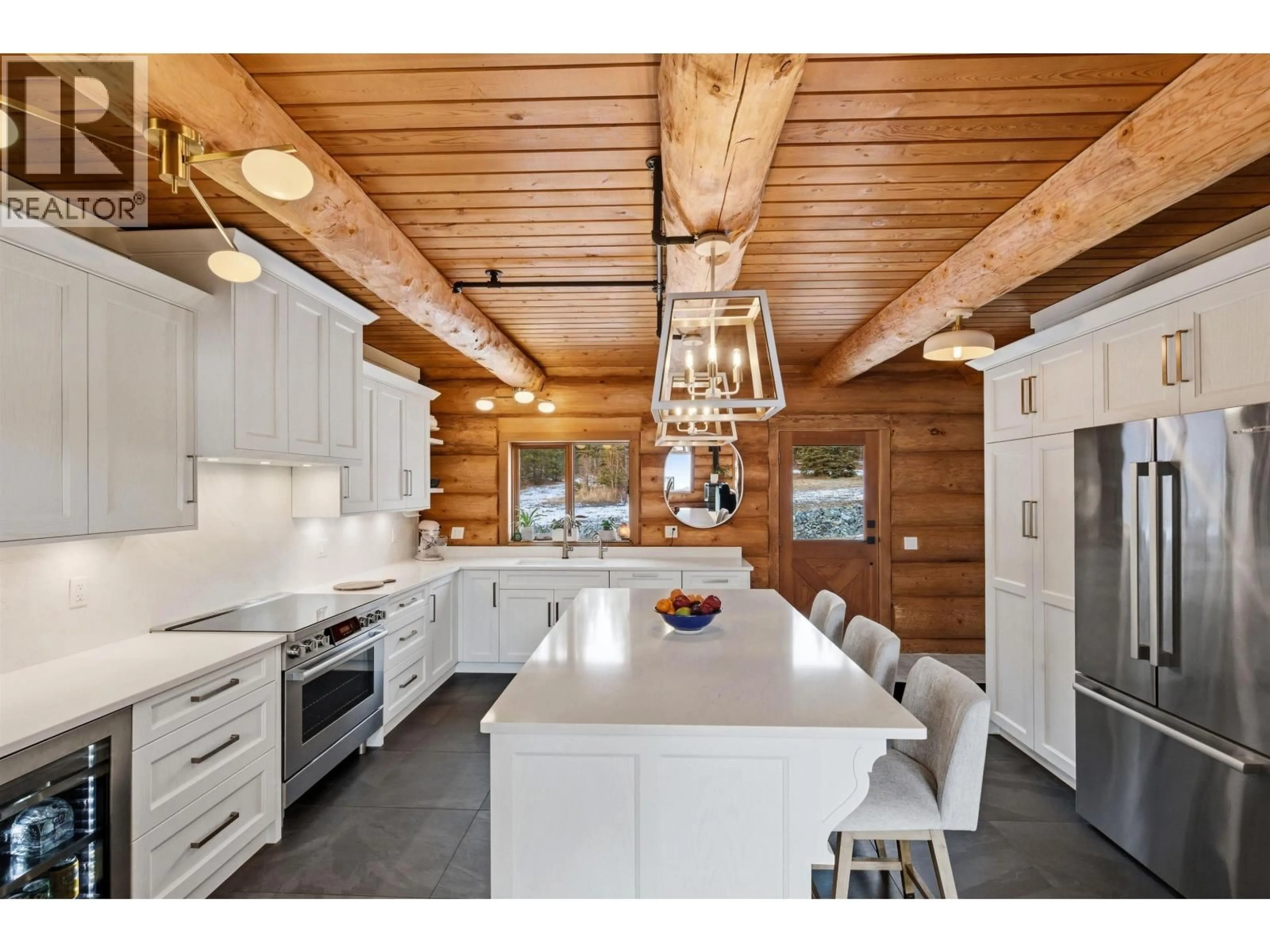 Open concept kitchen, wood/laminate floor for 3350 LIKELY ROAD, 150 Mile House British Columbia V0K2G0
