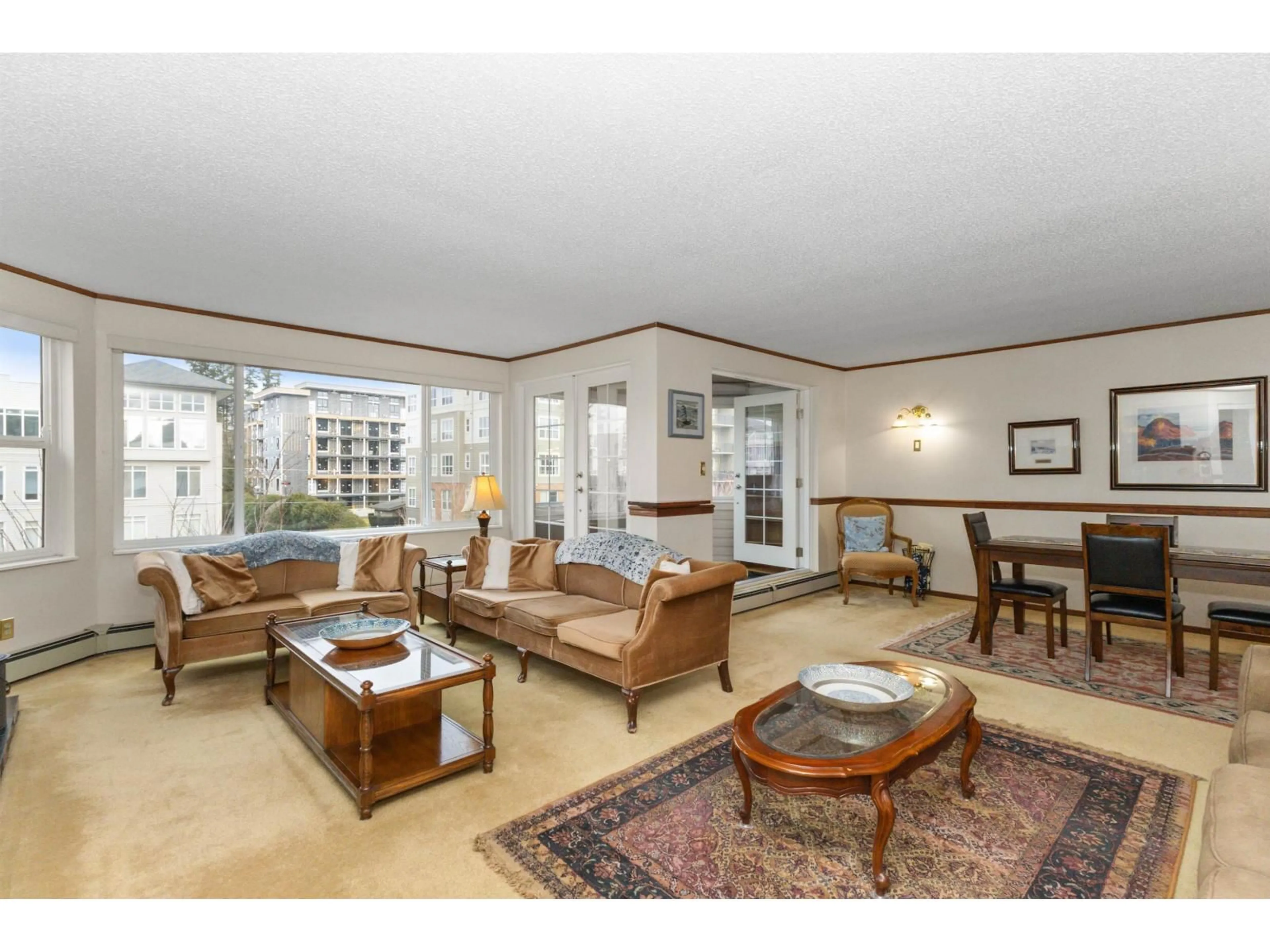 Living room with furniture, unknown for 302 - 32098 GEORGE FERGUSON WAY, Abbotsford British Columbia V2T2K6