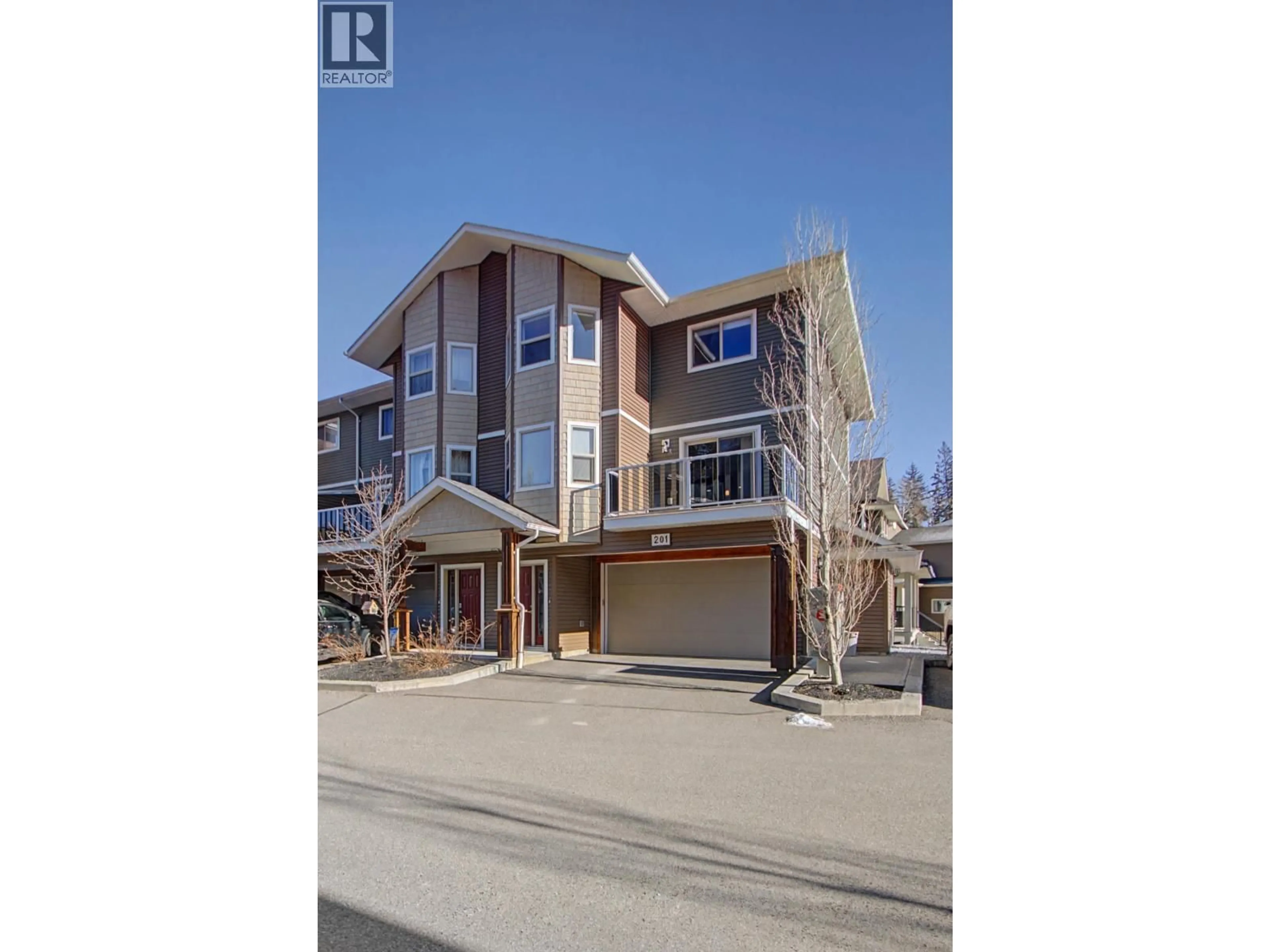 A pic from outside/outdoor area/front of a property/back of a property/a pic from drone, street for 201 - 7400 CREEKSIDE WAY, Prince George British Columbia V2N0C2