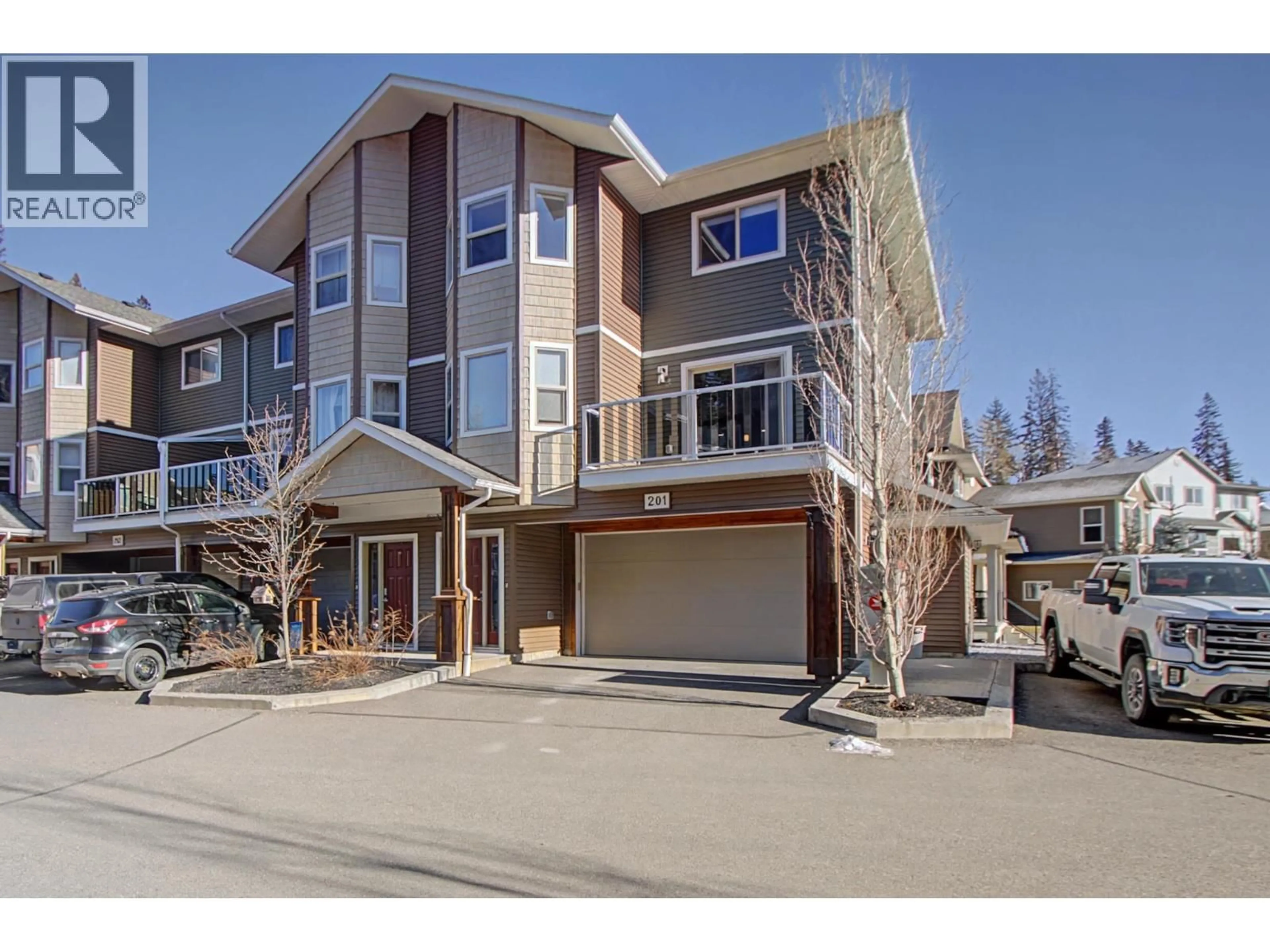 A pic from outside/outdoor area/front of a property/back of a property/a pic from drone, street for 201 - 7400 CREEKSIDE WAY, Prince George British Columbia V2N0C2